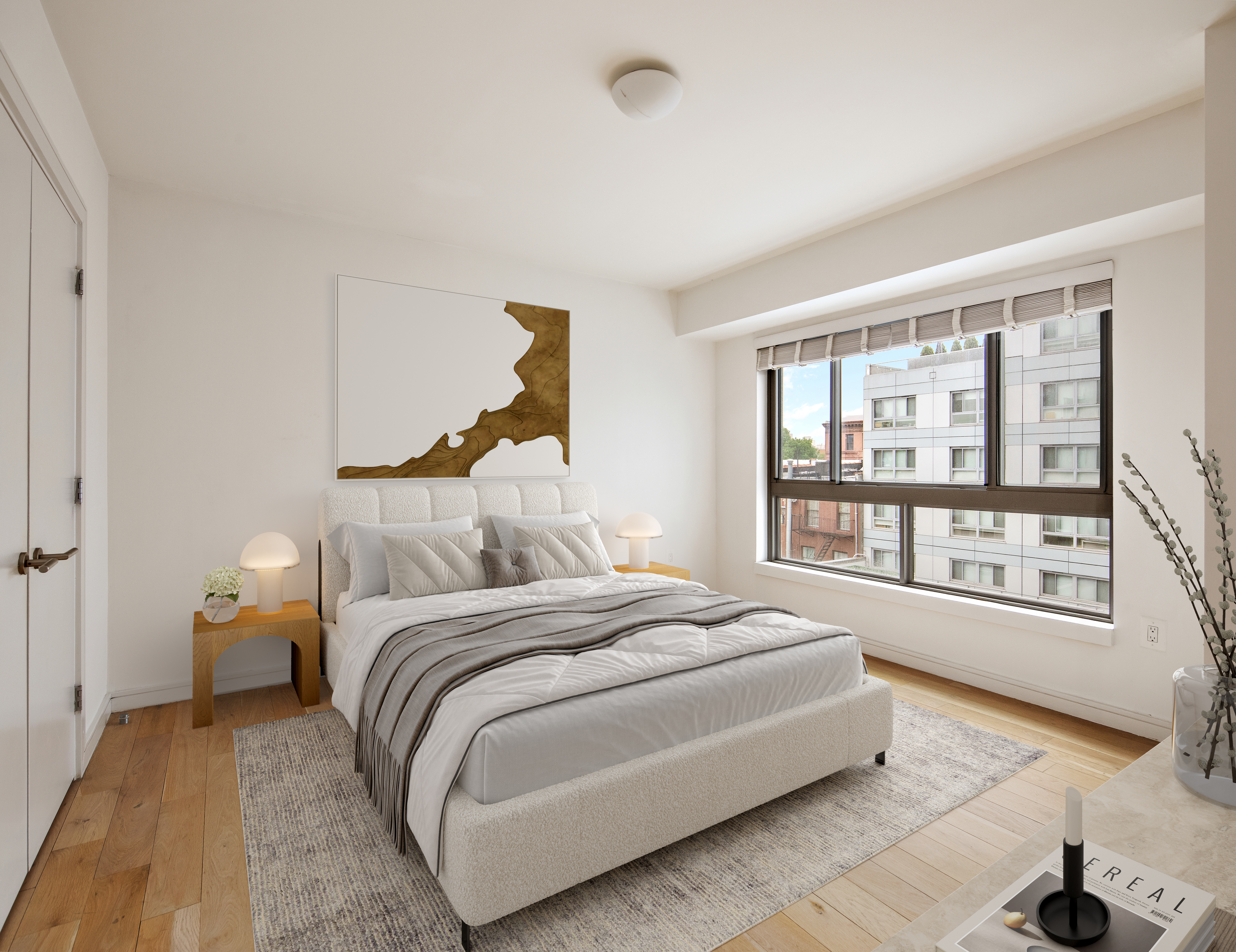 171 West 131st Street, Unit 519 Manhattan, NY 10027 - Photo 3 of 10 a bedroom with a bed and a large window