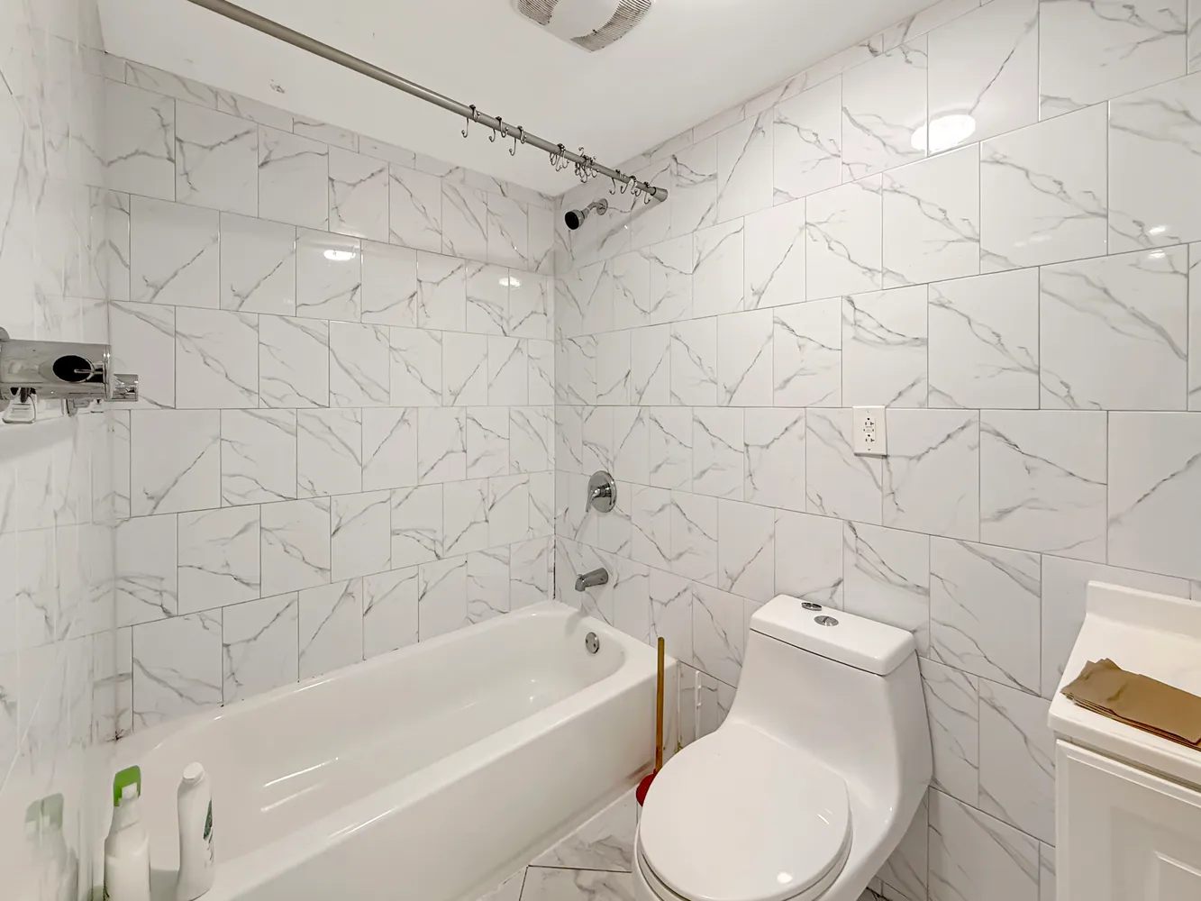 a bathroom with a toilet and a bathtub