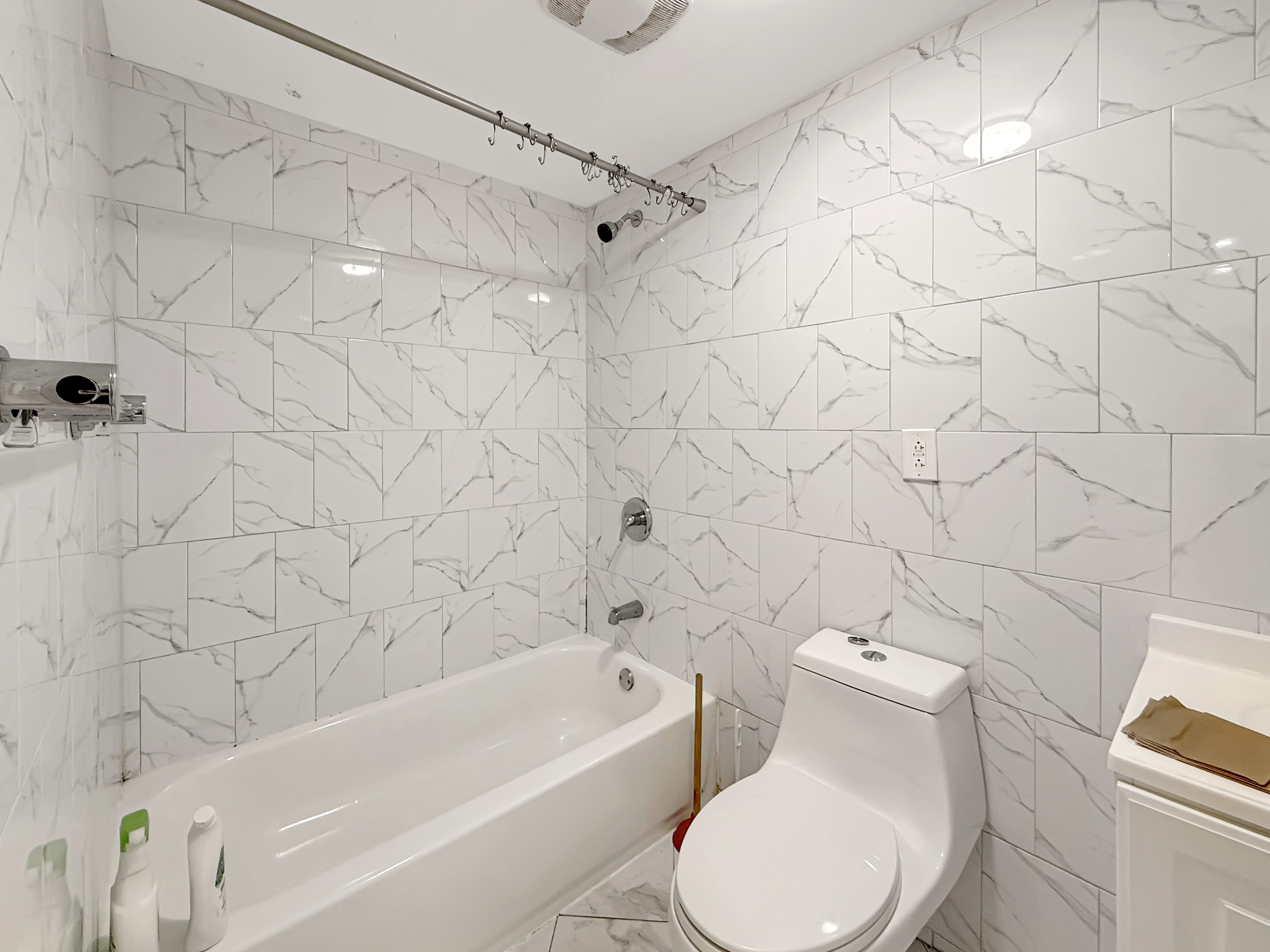 432 Chauncey Street, Unit 1 Brooklyn, NY 11233 - Photo 8 of 9 a bathroom with a toilet and a bathtub