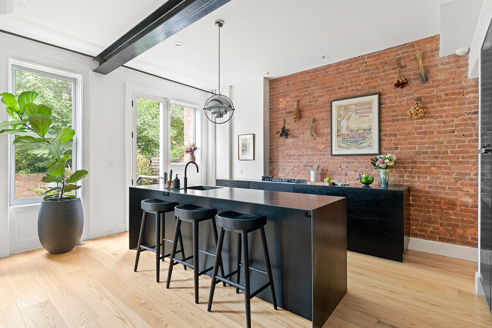 125 Rutland Road Brooklyn, NY 11225 - Photo 5 of 22 a kitchen with a table chairs and wooden floor
