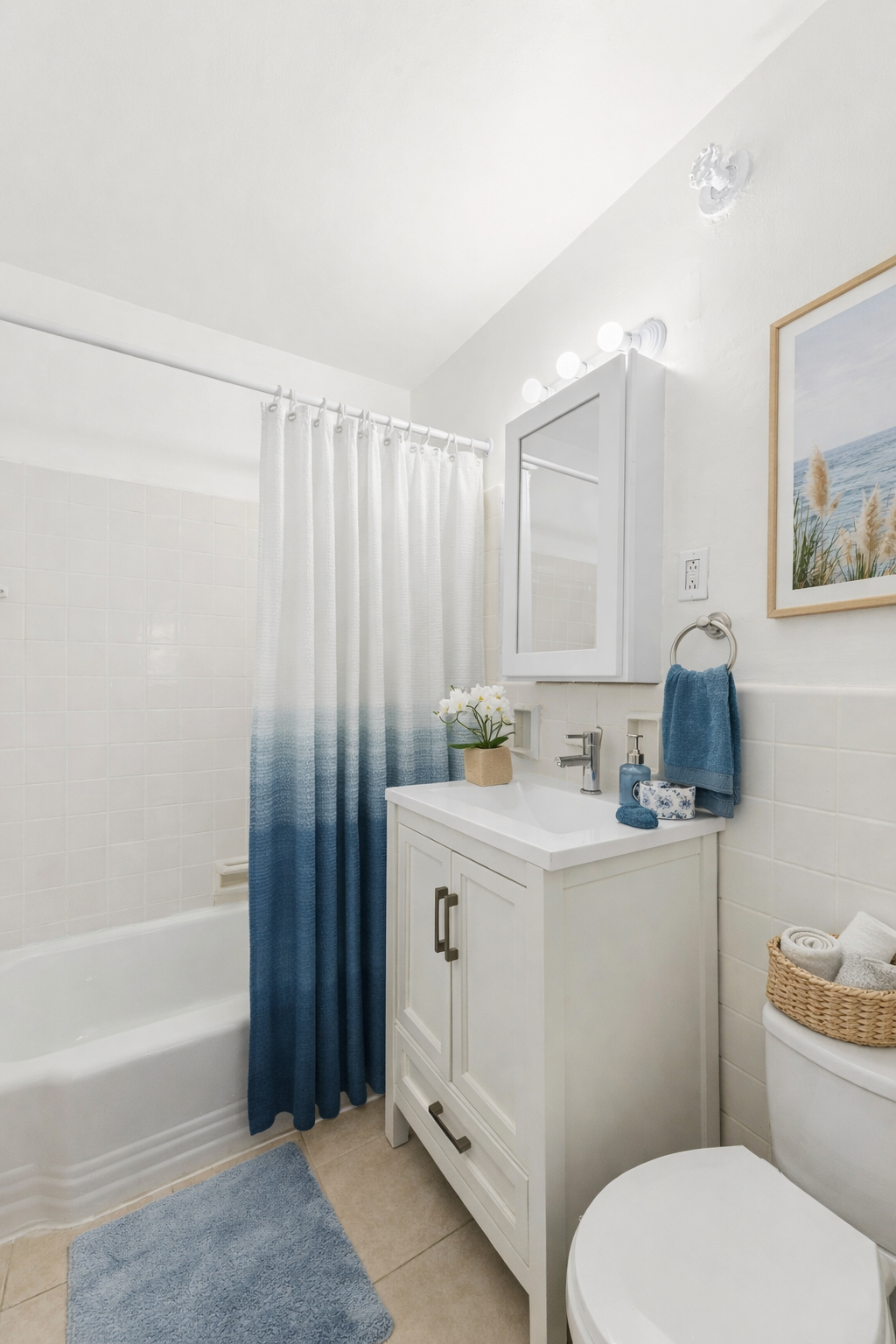 6645 Broadway, Unit 7E Bronx, NY 10471 - Photo 4 of 11 a bathroom with a sink a toilet and shower