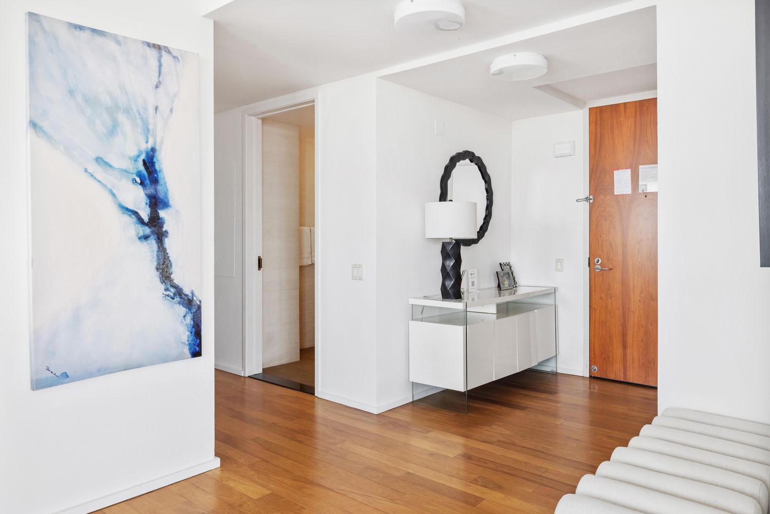 a view of living room with furniture and wooden floor