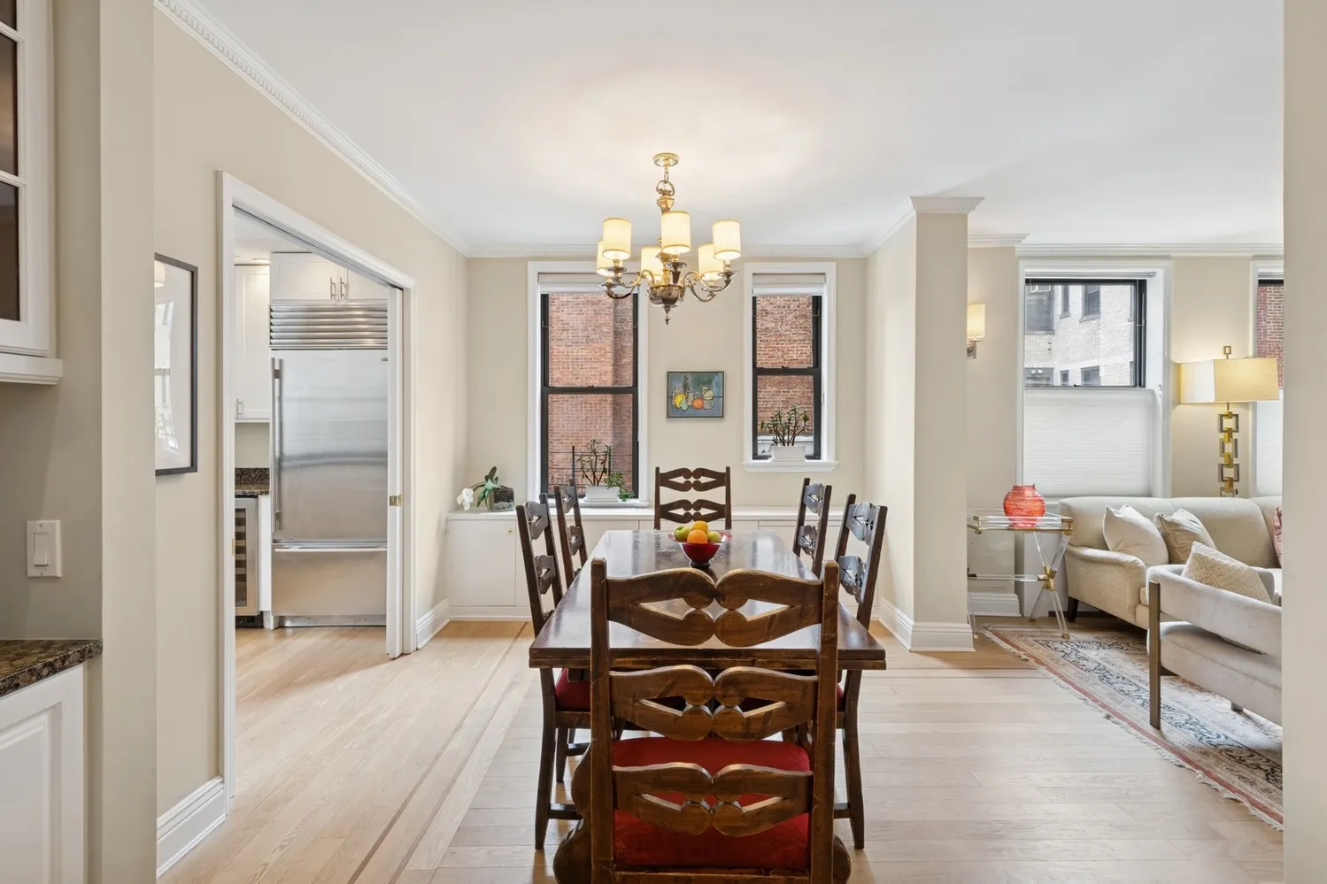 a view of a dining room with furniture and chandelier