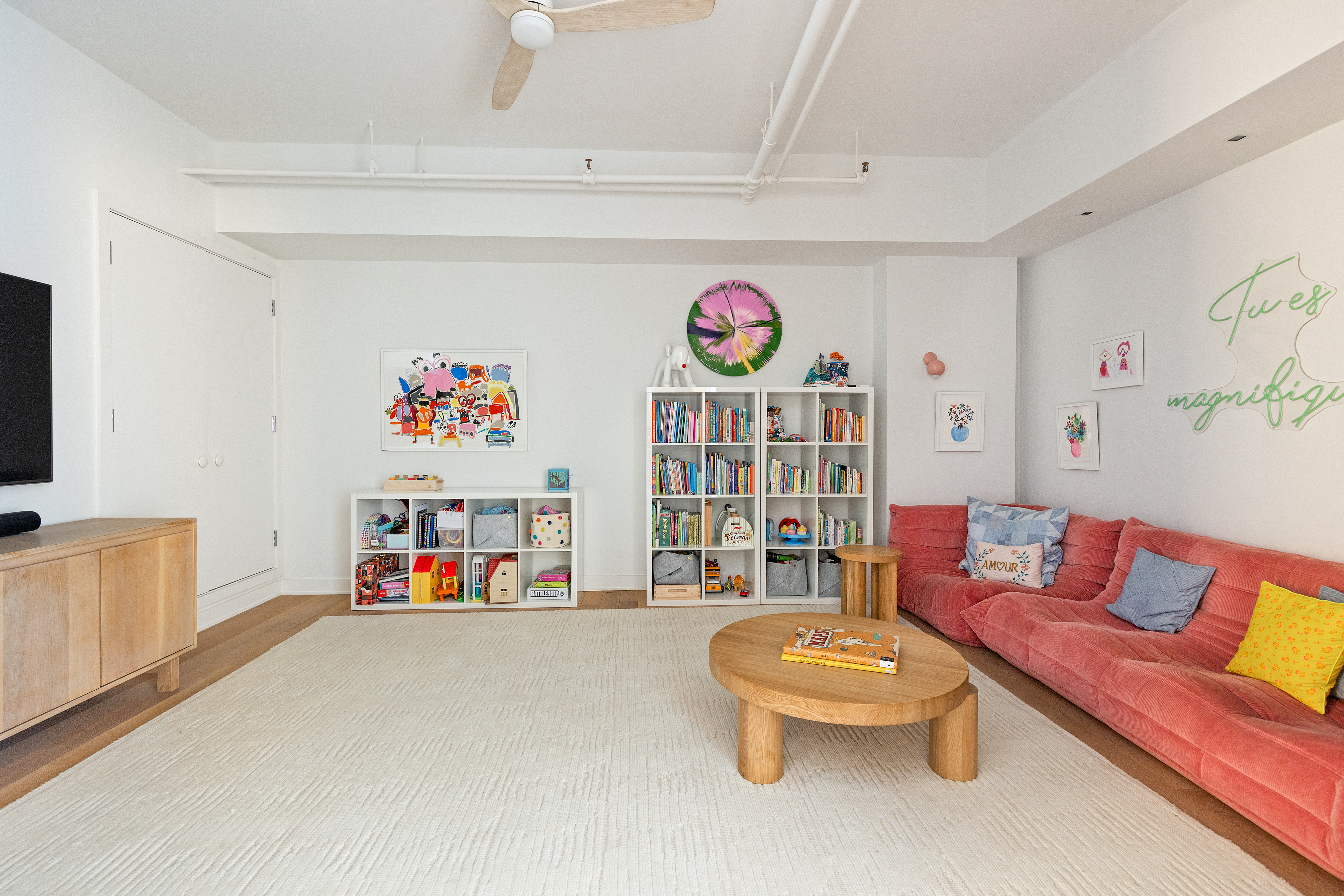 40 East 19th Street, Unit 7 Manhattan, NY 10003 - Photo 12 of 15 a living room with furniture cabinets and a window