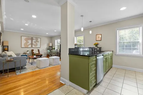 a kitchen with sink and cabinets
