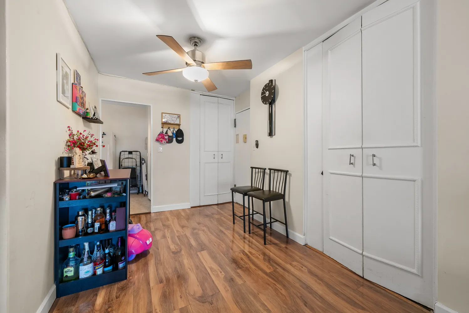 a view of a workspace with furniture and wooden floor