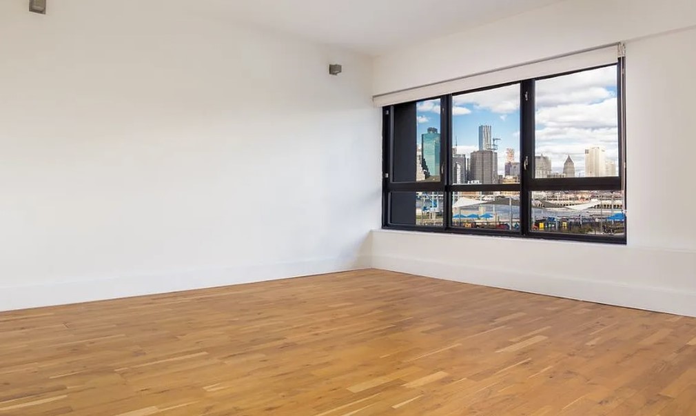 360 Furman Street, Unit 221 Brooklyn, NY 11201 - Photo 5 of 36 a view of an empty room with a window