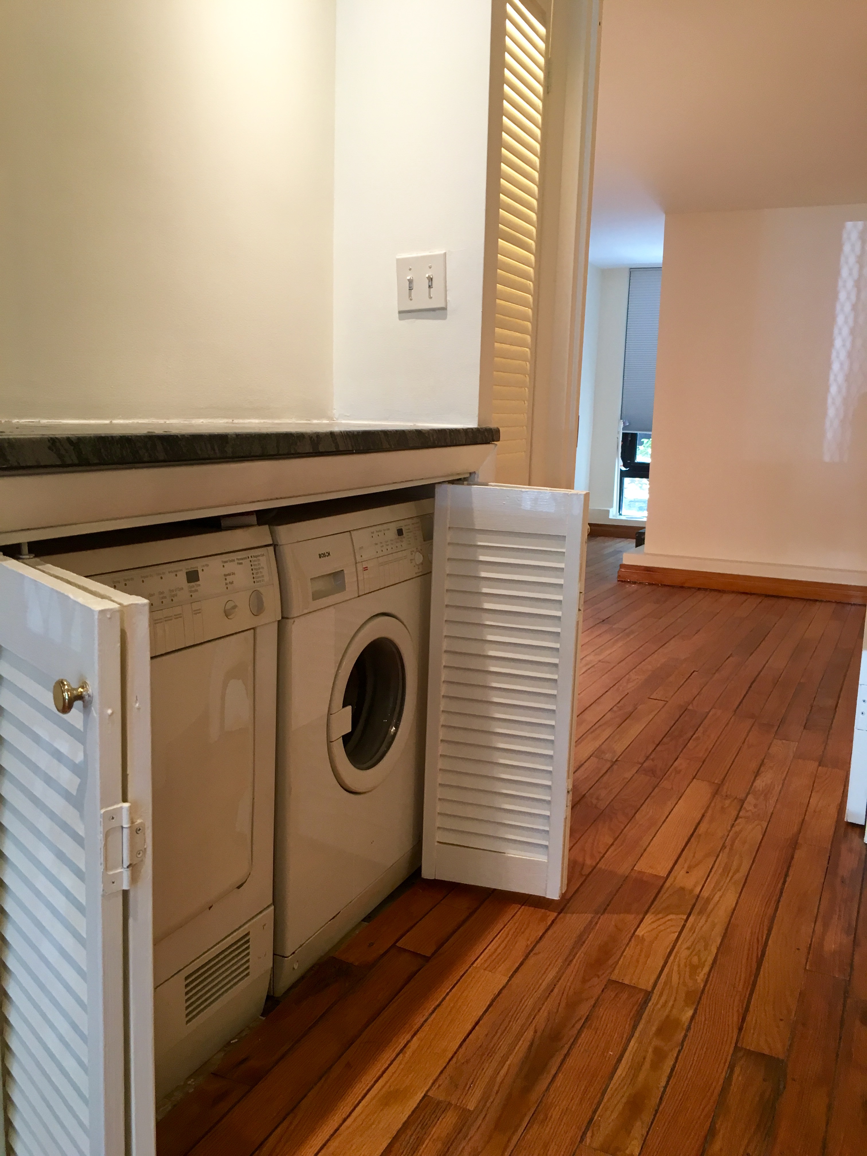 162 Christopher Street, Unit TH4 Manhattan, NY 10014 - Photo 5 of 5 a utility room with dryer and washer