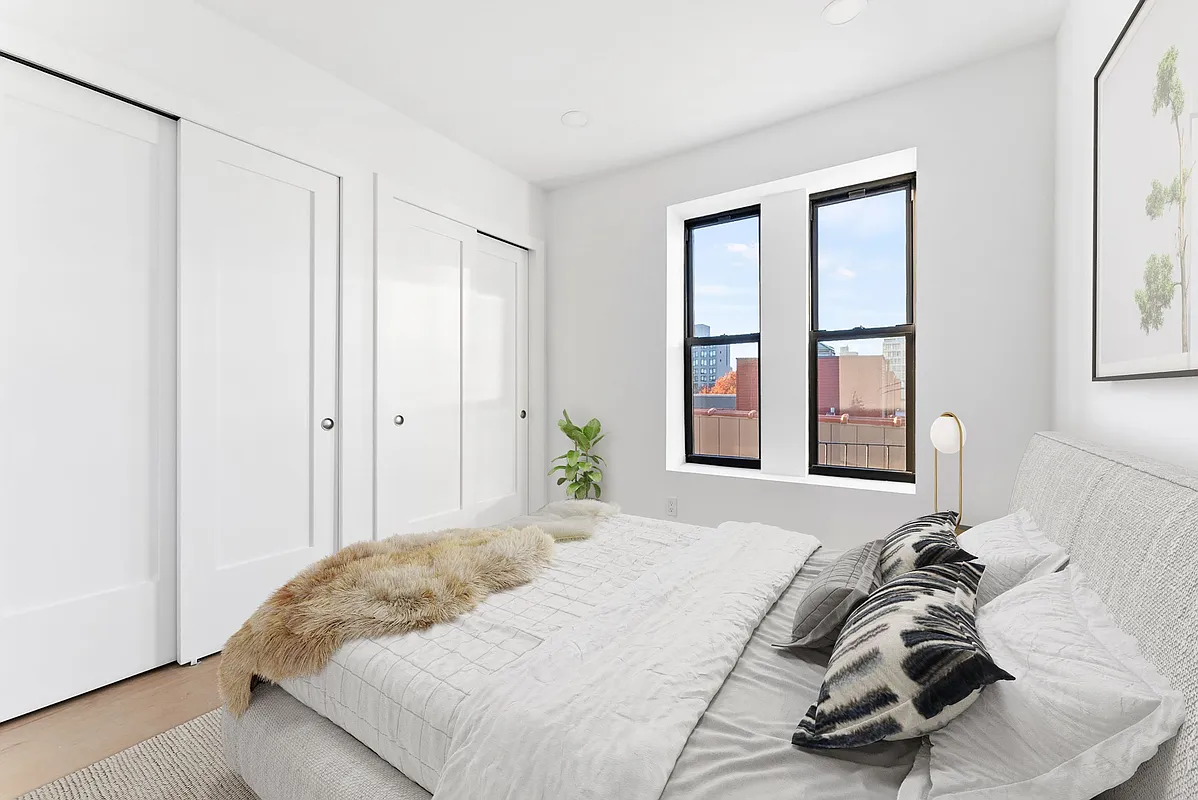 88 5th Avenue, Unit 4L Brooklyn, NY 11217 - Photo 2 of 5 a bedroom with a bed and a window