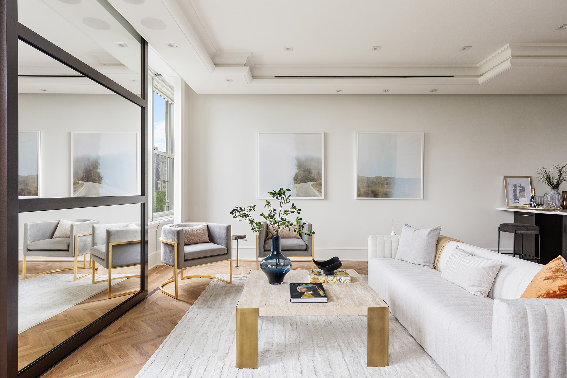 1 Central Park South, Unit 8010203 Manhattan, NY 10019 - Photo 12 of 45 a living room with furniture and a large window