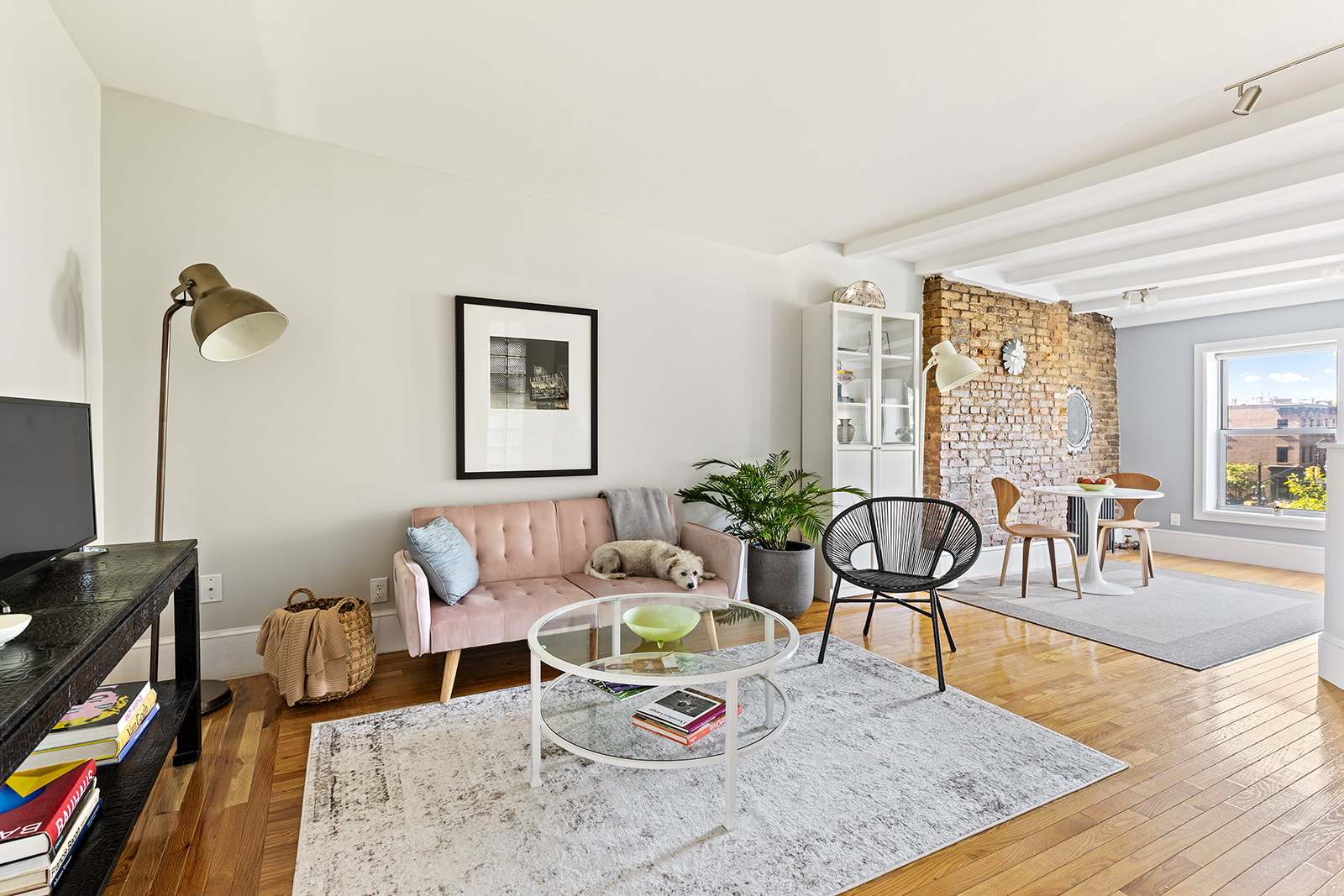 334 Union Street, Unit 3 Brooklyn, NY 11231 - Photo 1 of 10 a living room with furniture and a flat screen tv