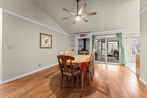 a view of a dining room with furniture window and wooden floor