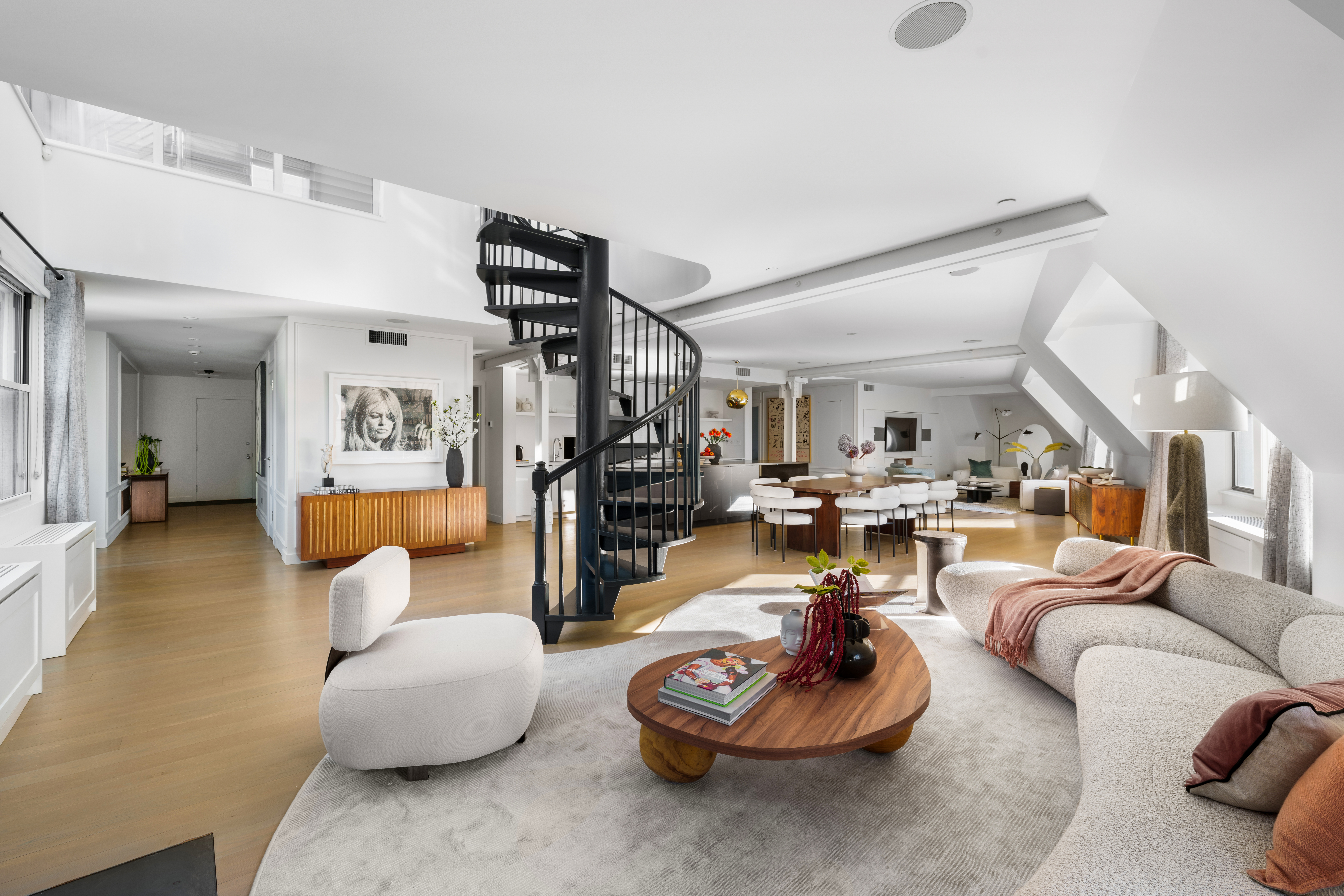 1200 Broadway, Unit PH89 Manhattan, NY 10001 - Photo 11 of 47 a living room with furniture and a wooden floor