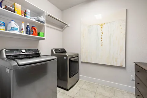 a utility room with washer and dryer