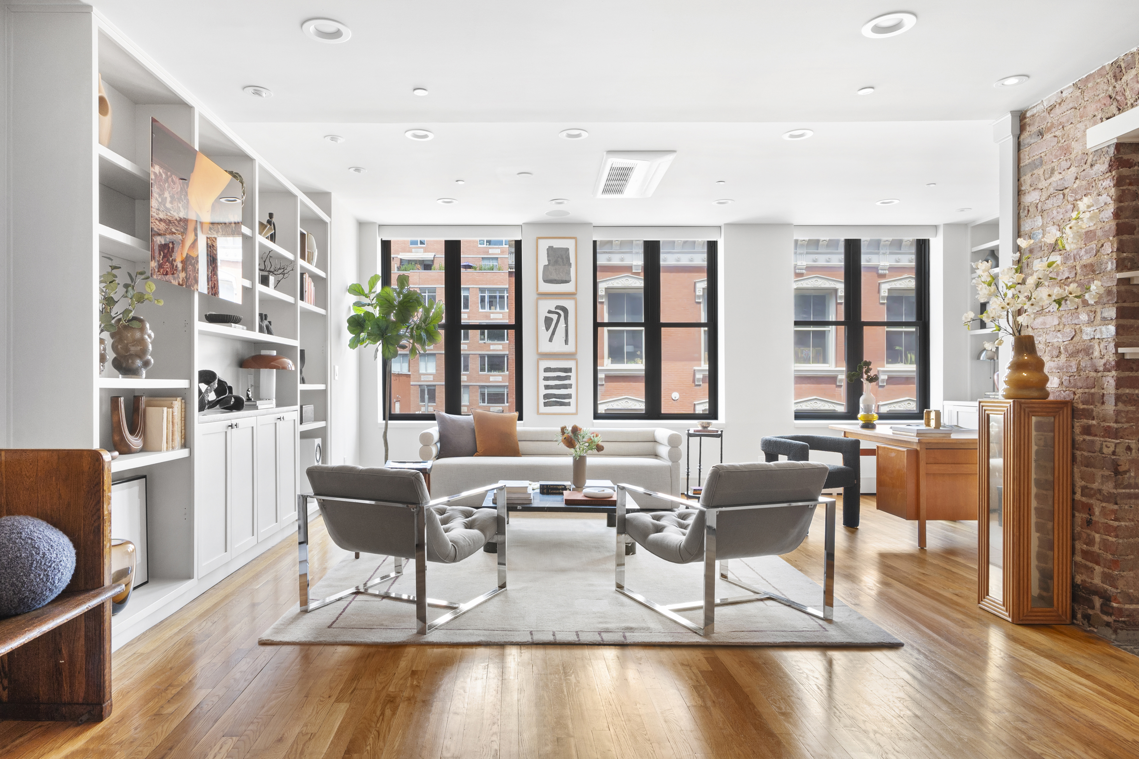 120 West 20th Street, Unit PH Manhattan, NY 10011 - Photo 1 of 15 a living room with furniture and floor to ceiling windows