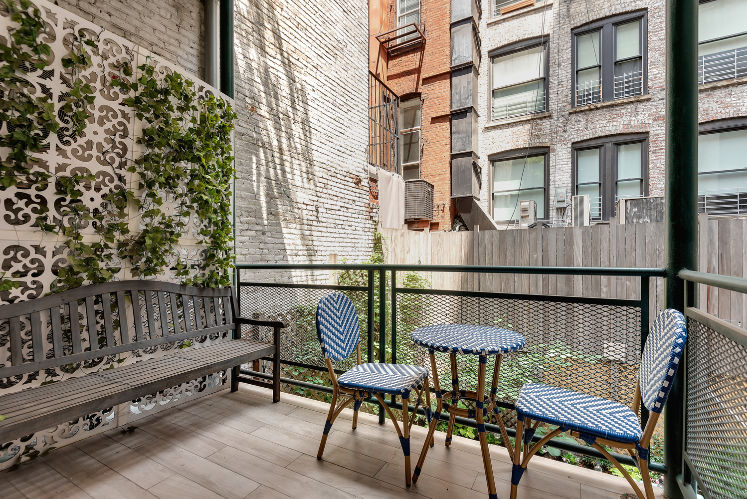 41 East 19th Street, Unit 1B Manhattan, NY 10003 - Photo 6 of 8 a balcony with table and chairs