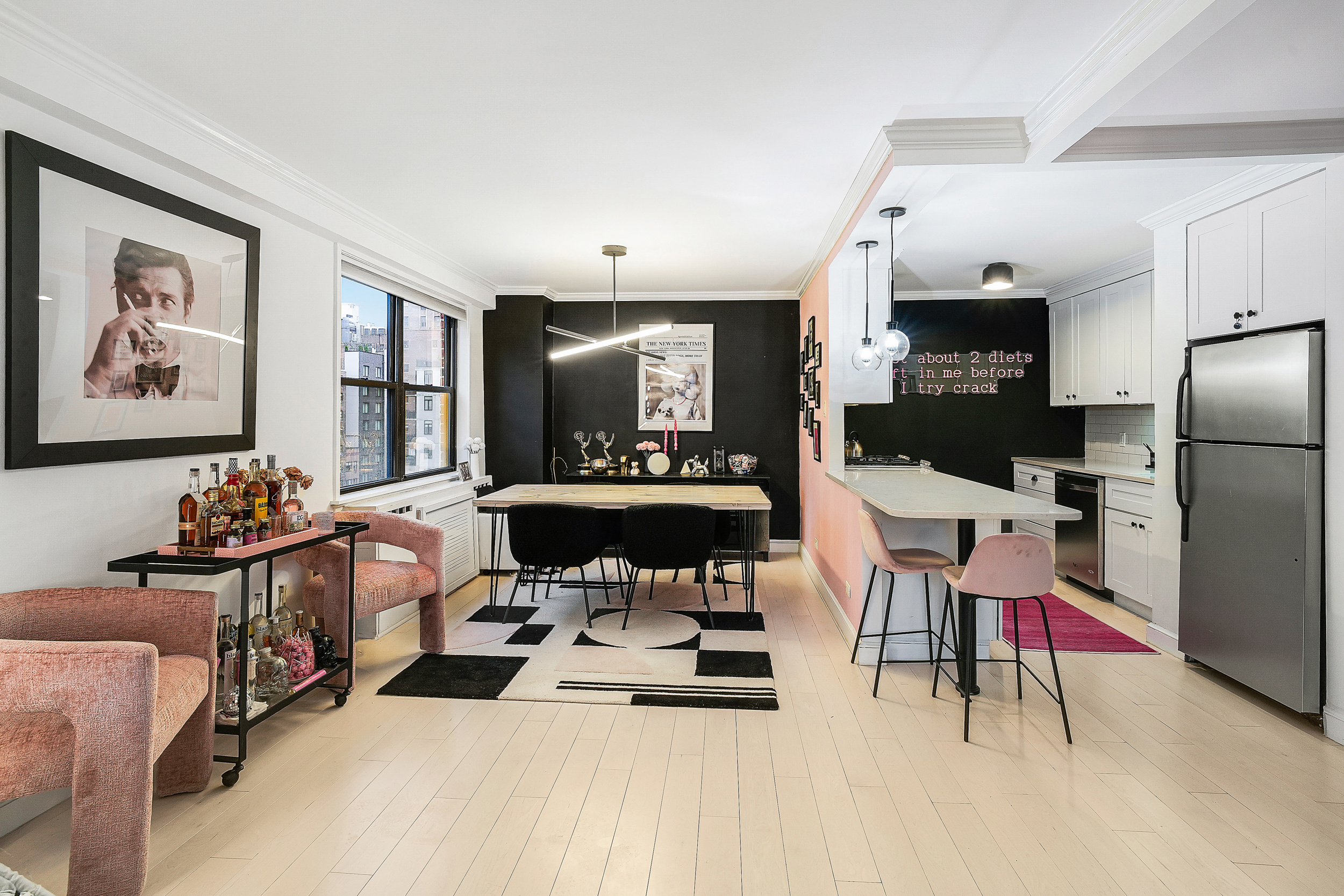 330 3rd Avenue, Unit 15G Manhattan, NY 10010 - Photo 3 of 14 a living room with furniture a chandelier and a dining table