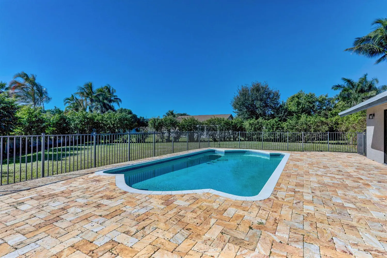 a view of swimming pool with a yard