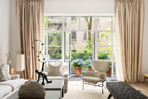 a living room with furniture and a window