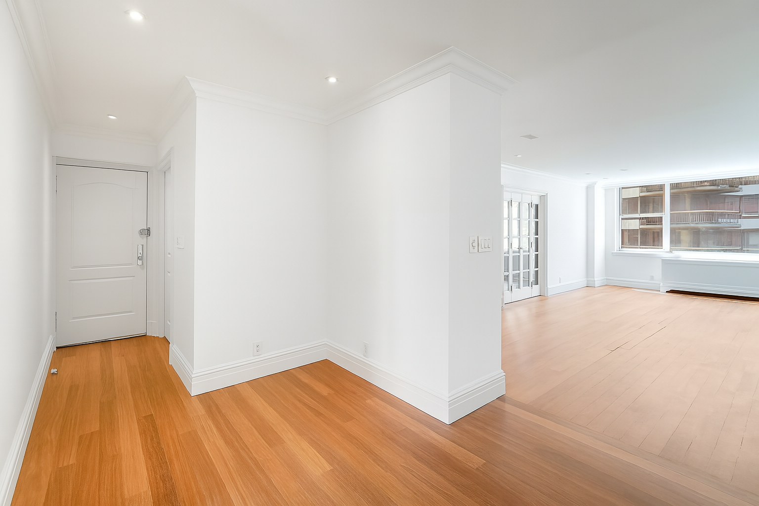 175 East 62nd Street, Unit 8D Manhattan, NY 10065 - Photo 10 of 24 wooden floor in an empty room with a window