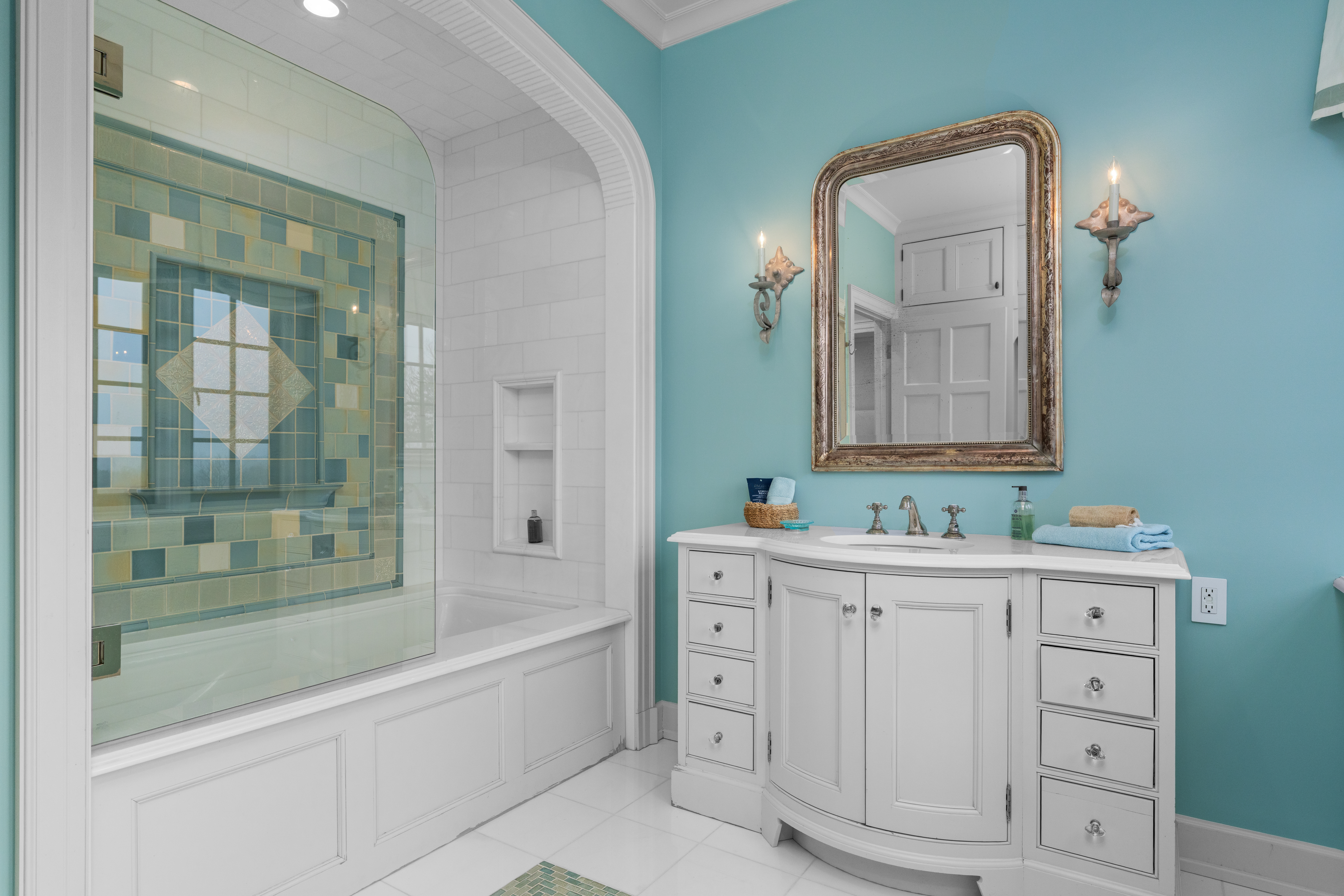 1033 Sugartown Road Berwyn, PA 19312 - Photo 34 of 53 a bathroom with a double vanity sink a mirror and a bathtub