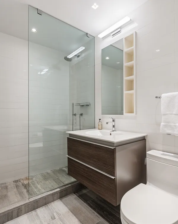 a bathroom with a sink toilet and shower