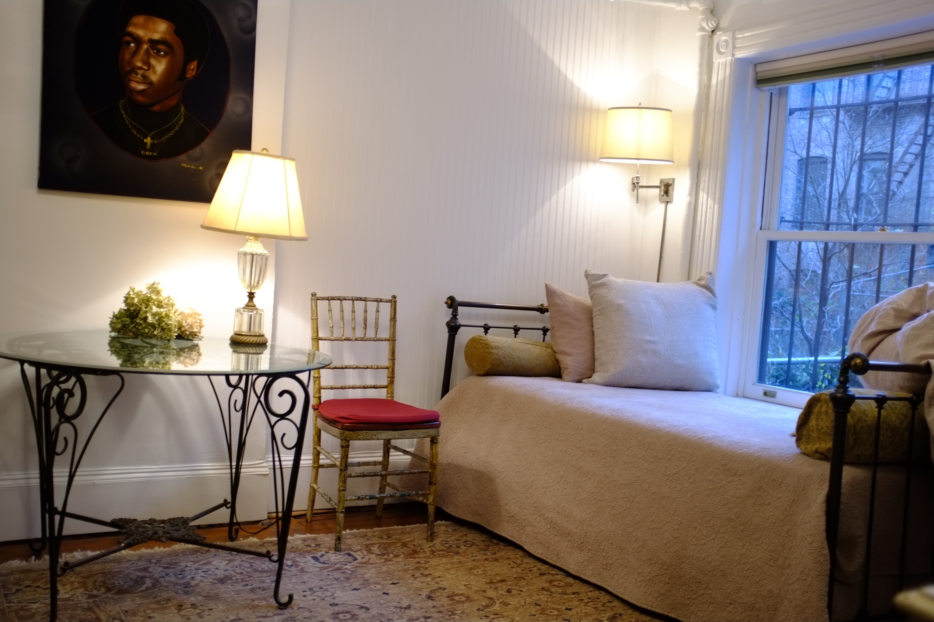 426 West 160th Street Manhattan, NY 10032 - Photo 27 of 33 a bedroom with a bed and a lamp on table