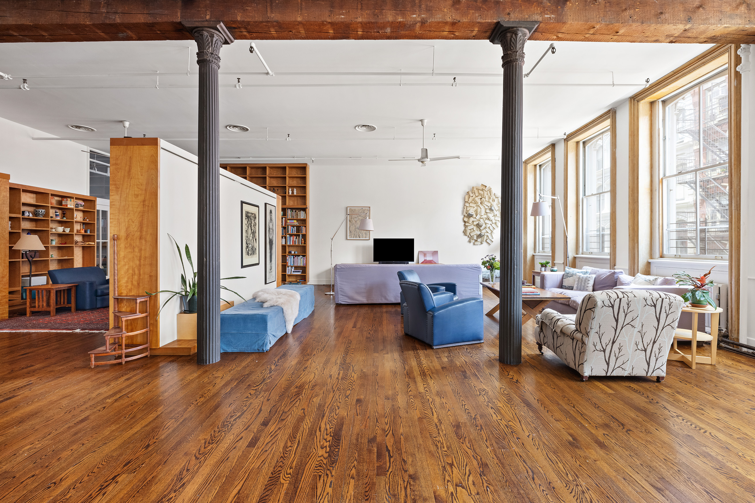 17 White Street, Unit 3B Manhattan, NY 10013 - Photo 2 of 19 a living room with furniture or couch and a wooden floor