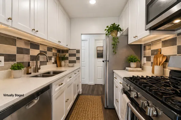 a kitchen with a sink stove and refrigerator