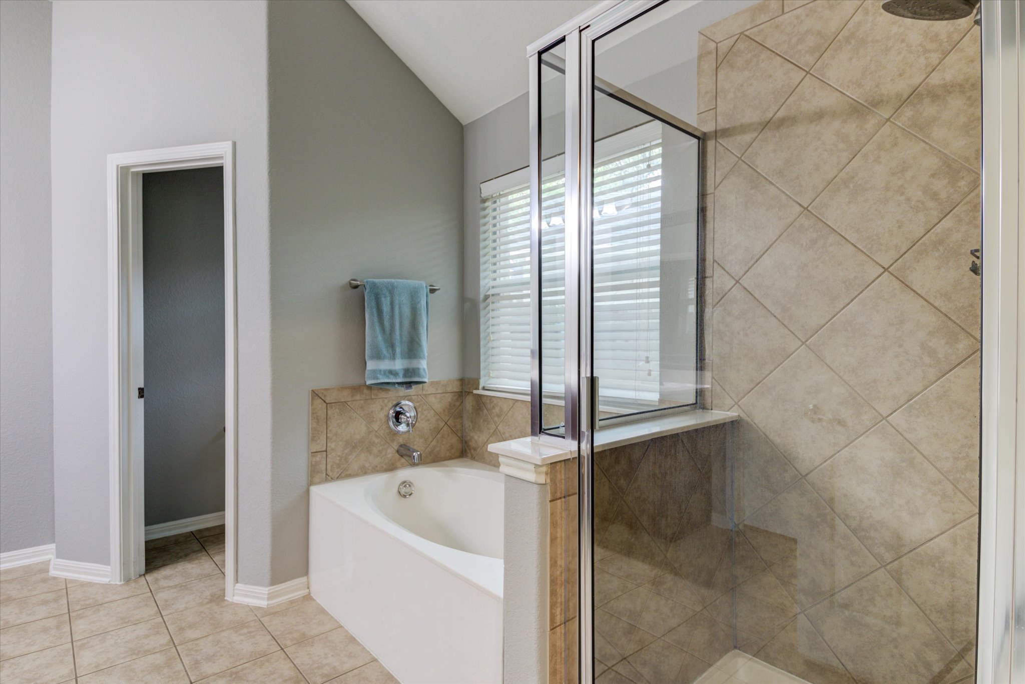 5412 Batak Lane Austin, TX 78749 - Photo 31 of 40 a bathroom with a bathtub and a shower