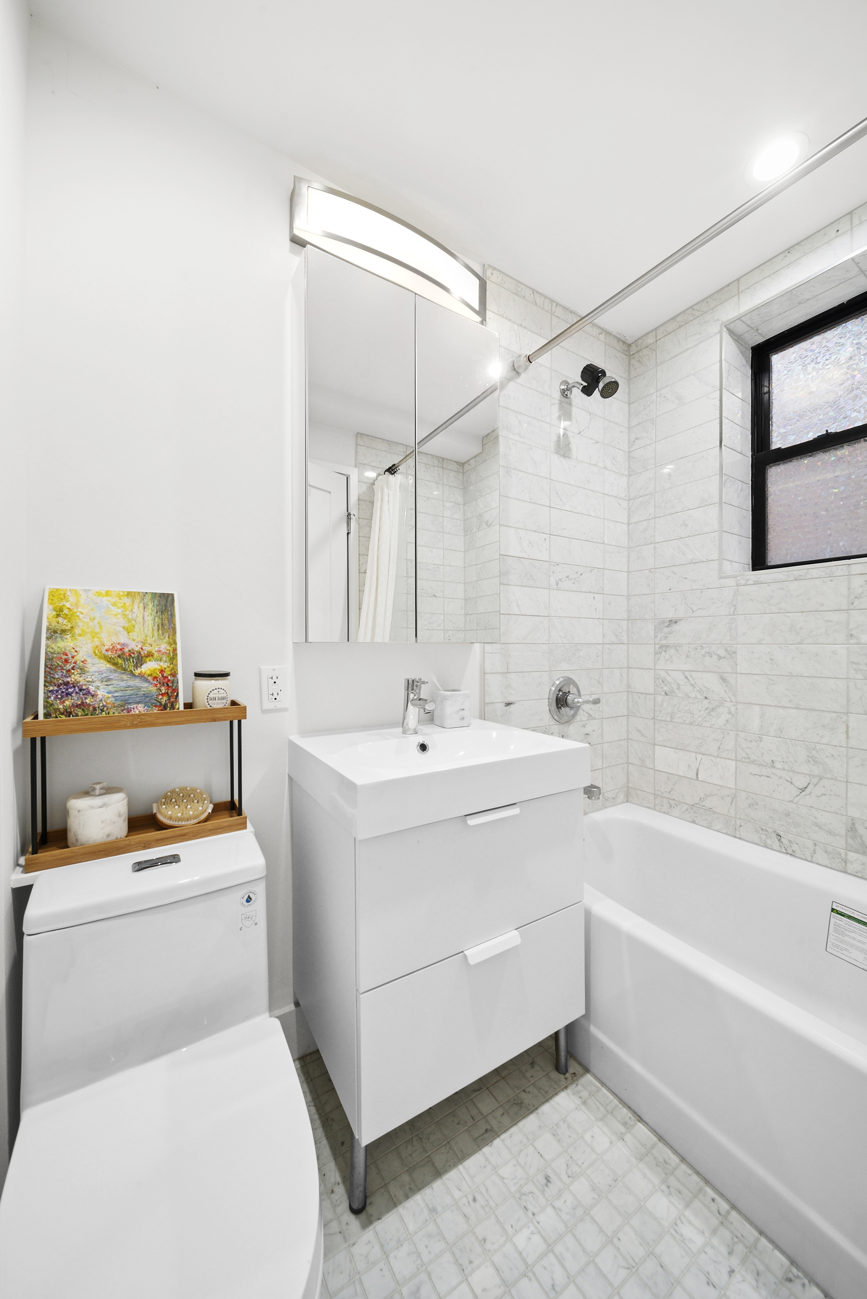 9511 Shore Road, Unit 505 Brooklyn, NY 11209 - Photo 4 of 18 a bathroom with a bathtub and a toilet