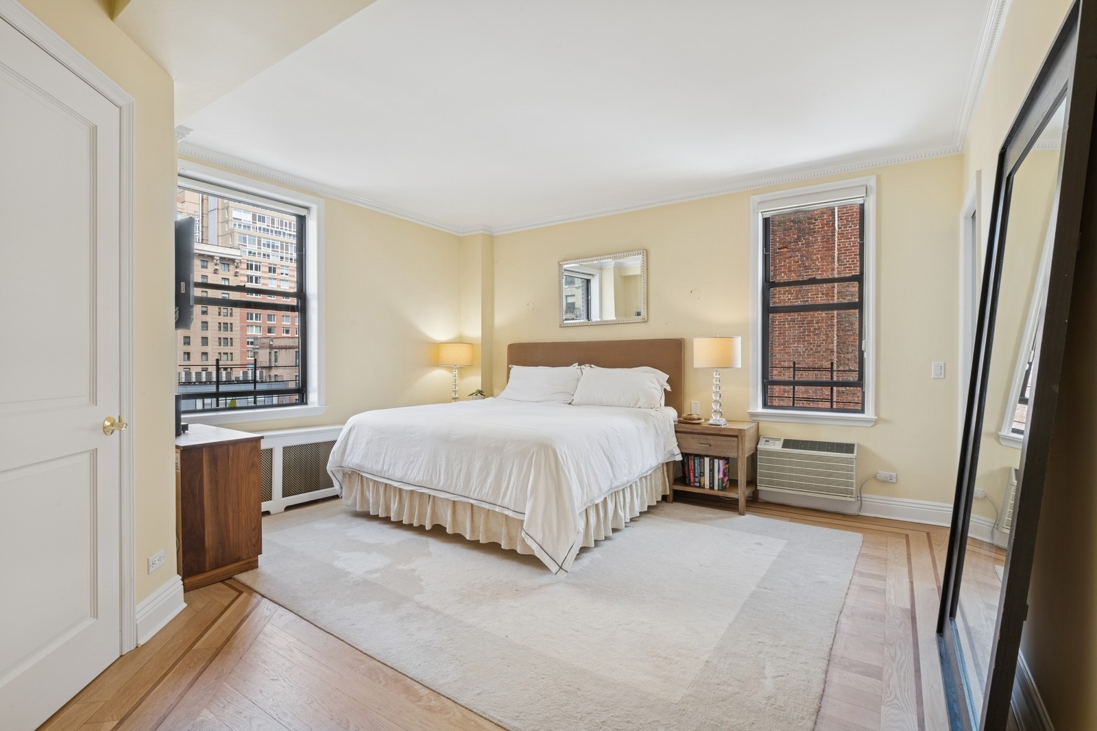 514 West End Avenue, Unit 8/9A Manhattan, NY 10024 - Photo 17 of 24 a bedroom with a large bed and a window
