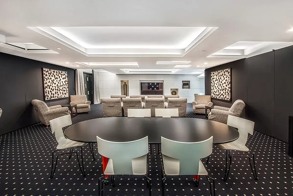 15 West 53rd Street, Unit 31C Manhattan, NY 10019 - Photo 11 of 14 a living room with furniture and a large window