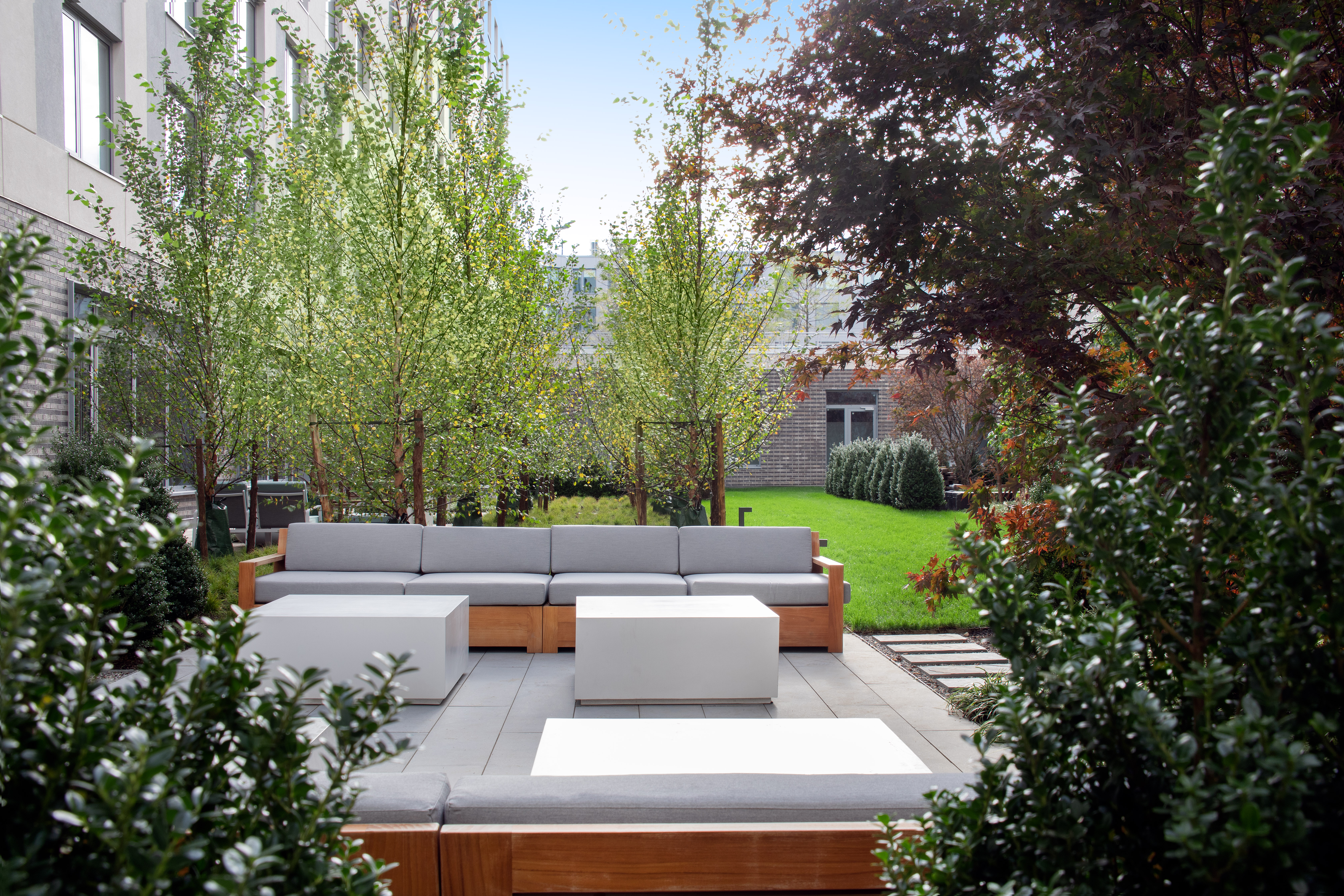 30-77 Vernon Boulevard, Unit PH811W Queens, NY 11102 - Photo 12 of 21 a view of a patio with couches and a fire pit