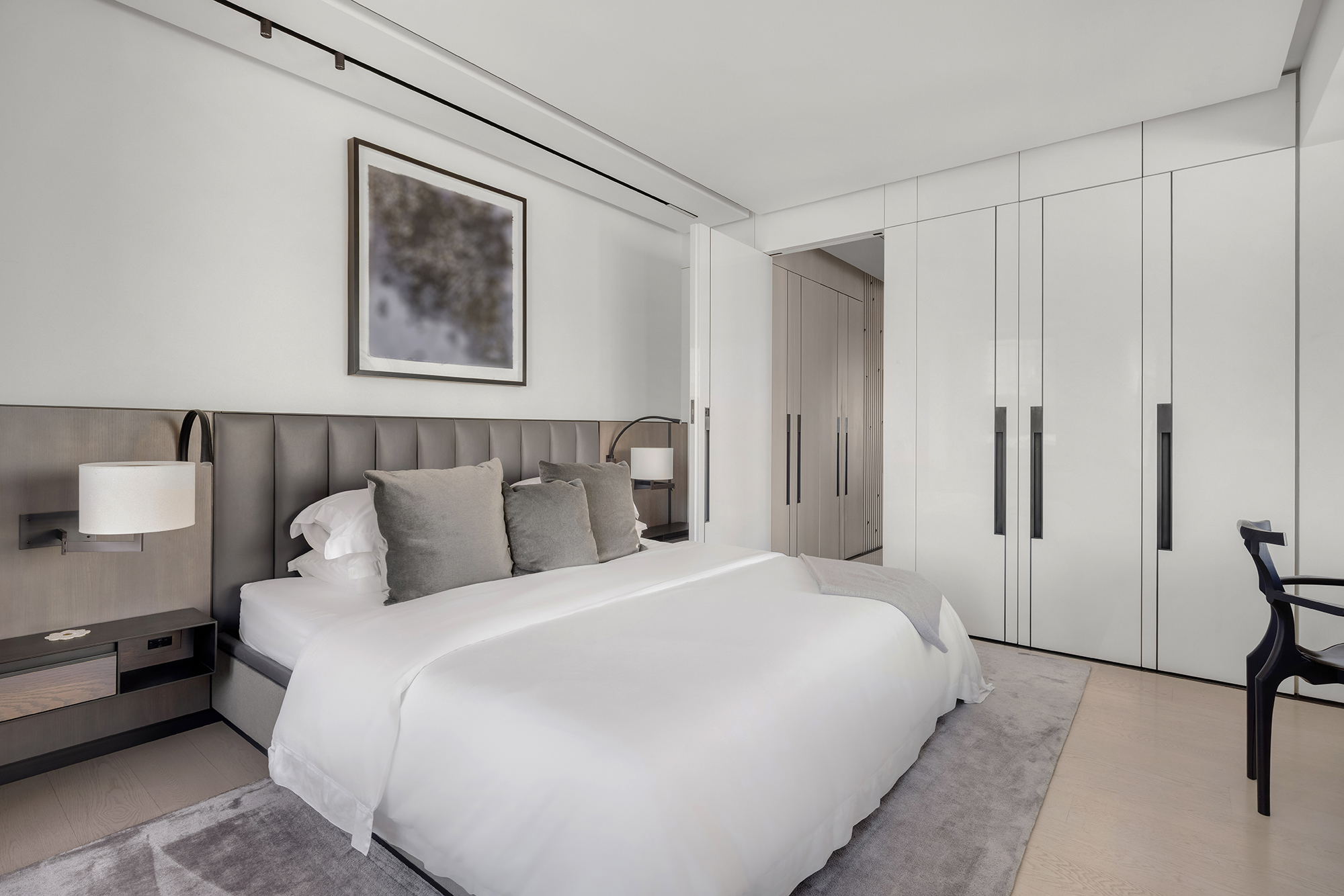 301 West 57th Street, Unit 36C Manhattan, NY 10019 - Photo 21 of 27 a bedroom with a bed and a painting on the wall