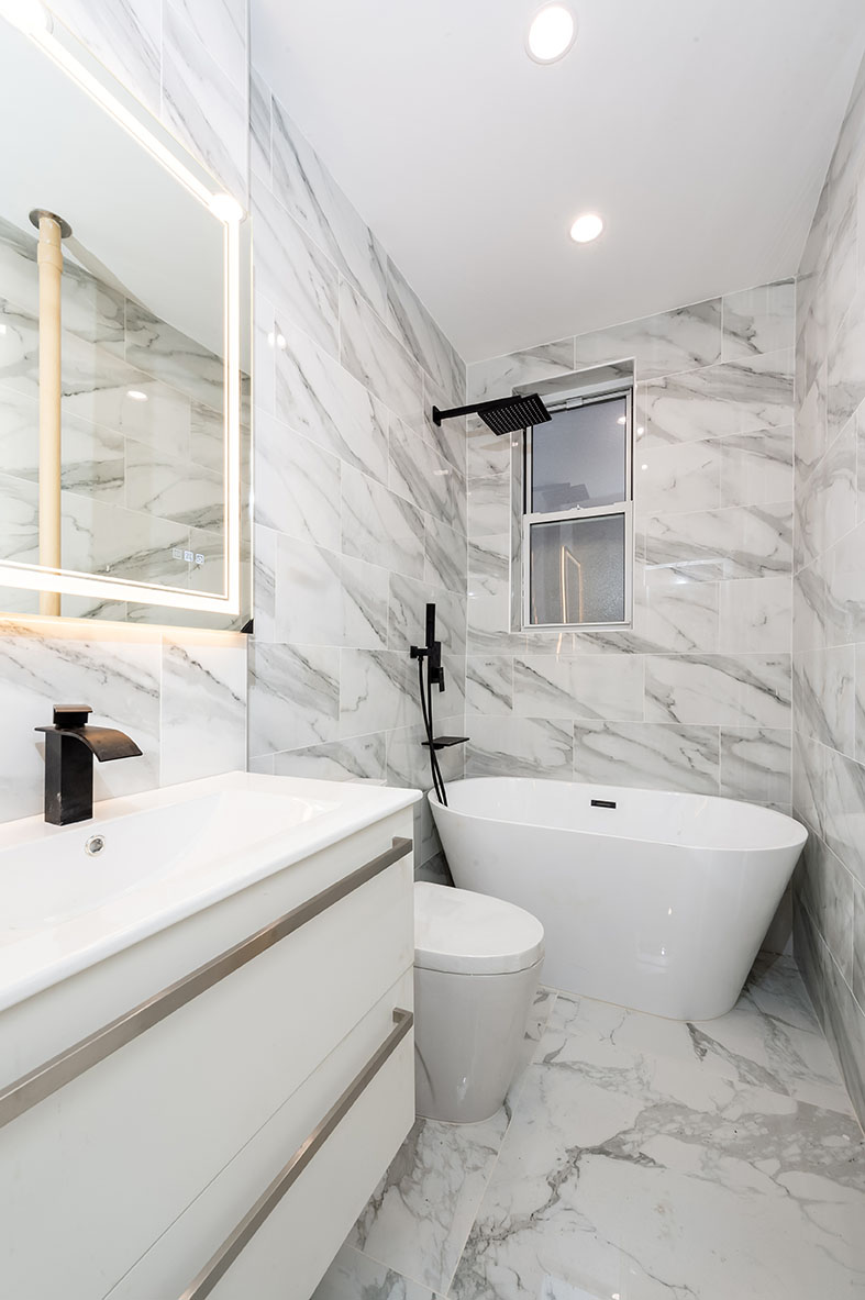 88 Brooklyn Avenue, Unit A3 Brooklyn, NY 11216 - Photo 5 of 12 a bathroom with a sink a toilet and bathtub