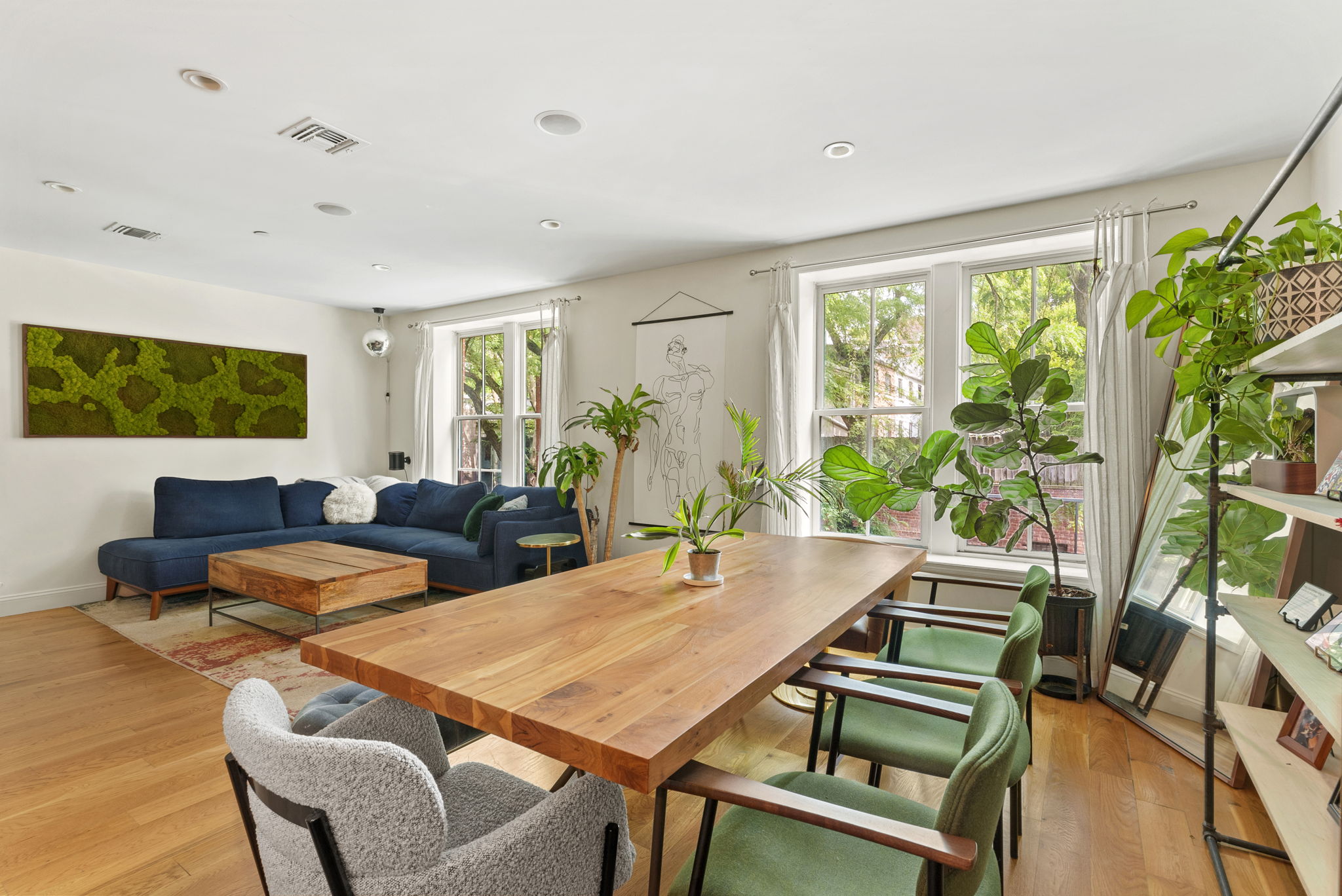 54 State Street, Unit 5 Brooklyn, NY 11201 - Photo 2 of 9 a living room with furniture a large window and wooden floor