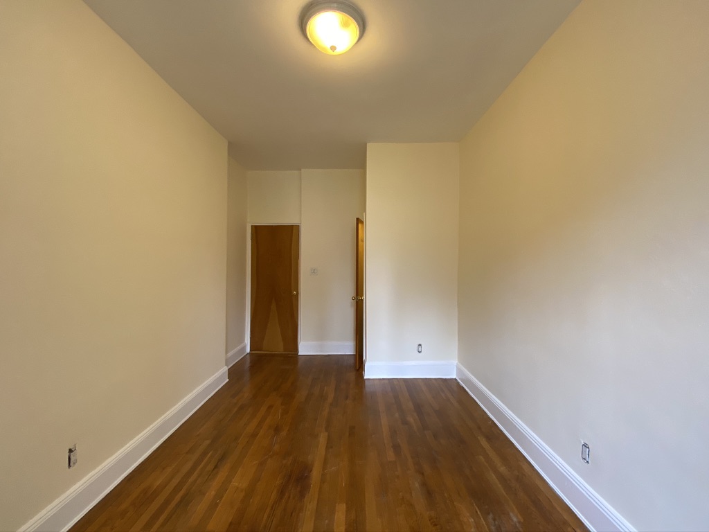 619 9th Avenue, Unit 3E Manhattan, NY 10036 - Photo 10 of 22 a view of a room with wooden floor