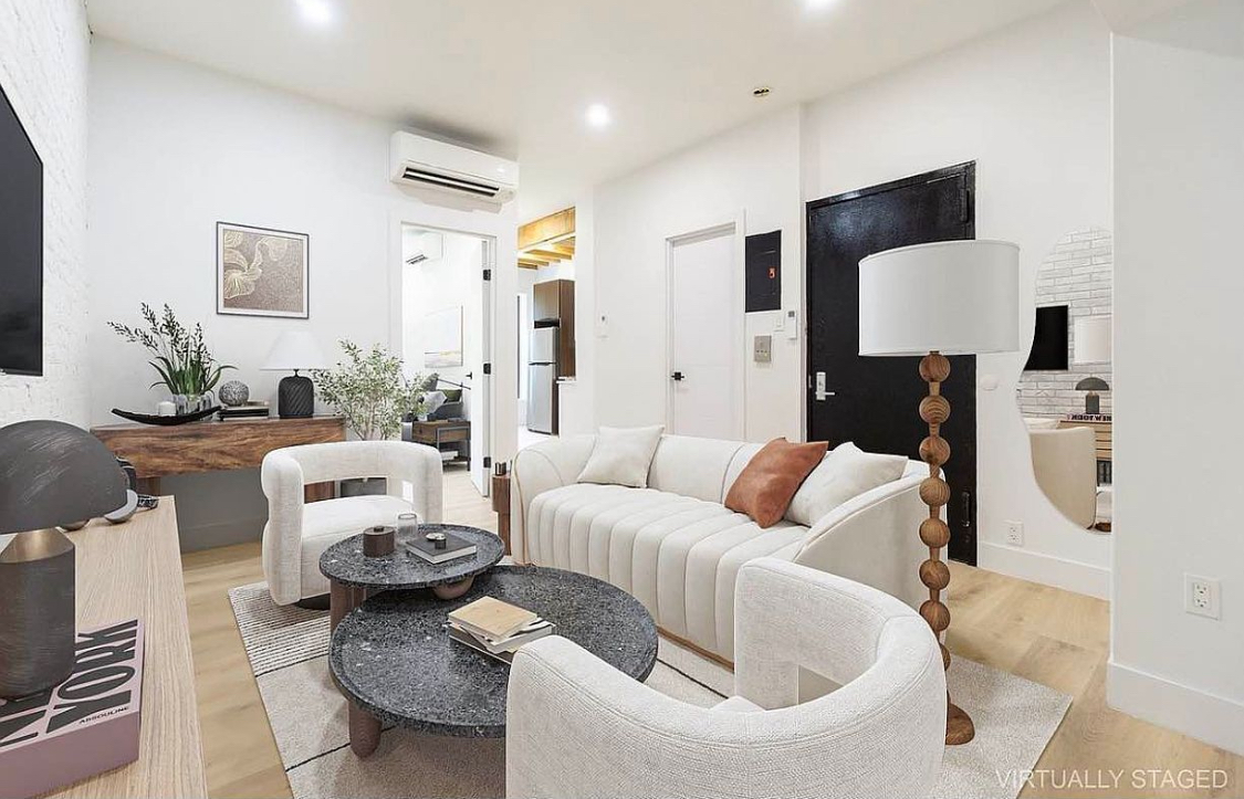 180 5th Avenue, Unit 3 Brooklyn, NY 11217 - Photo 2 of 13 a living room with furniture and a flat screen tv