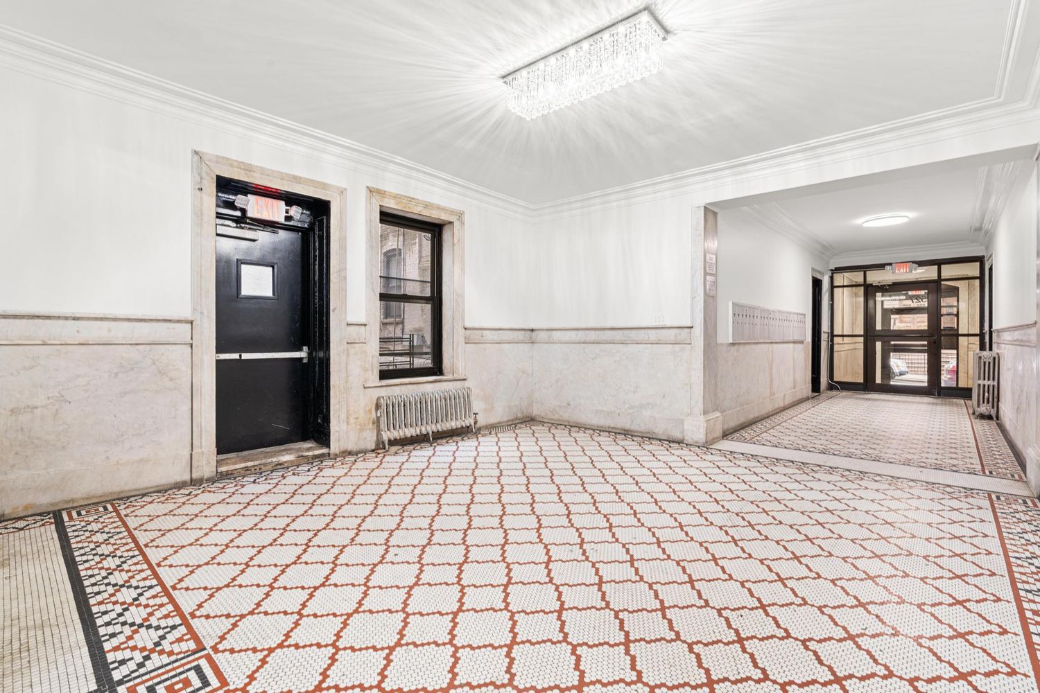 527 West 143rd Street, Unit 31 Manhattan, NY 10031 - Photo 27 of 29 a bedroom with a bed and a large window