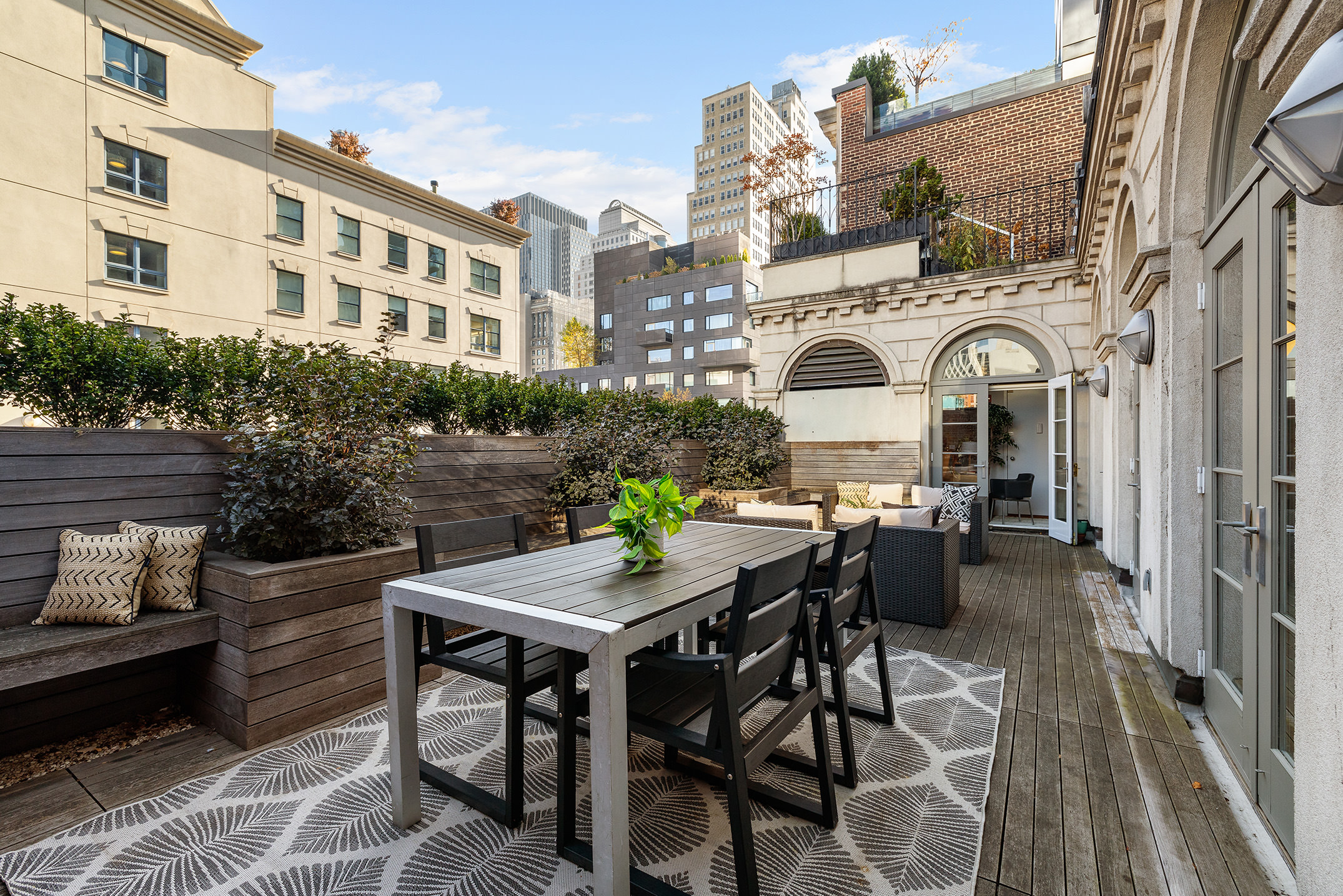 41 Warren Street, Unit 6 Manhattan, NY 10007 - Photo 13 of 23 a view of a patio with table and chairs and potted plants