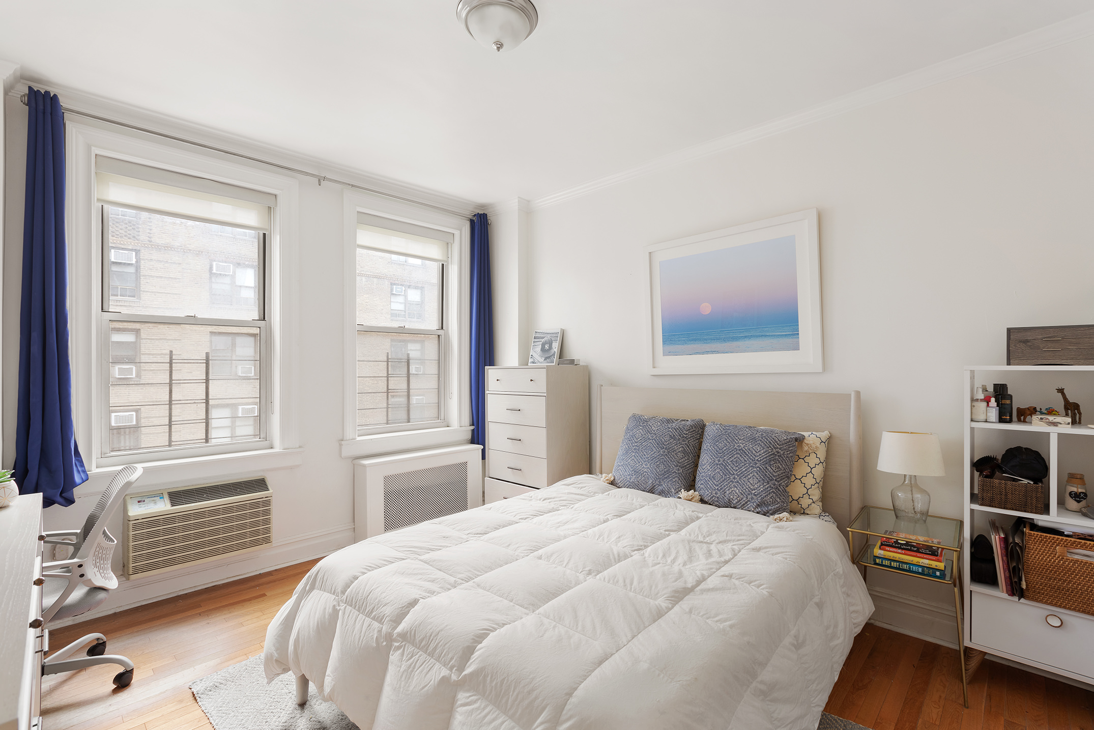 16 East 98th Street, Unit 7F Manhattan, NY 10029 - Photo 3 of 8 a bedroom with a bed and wooden floor