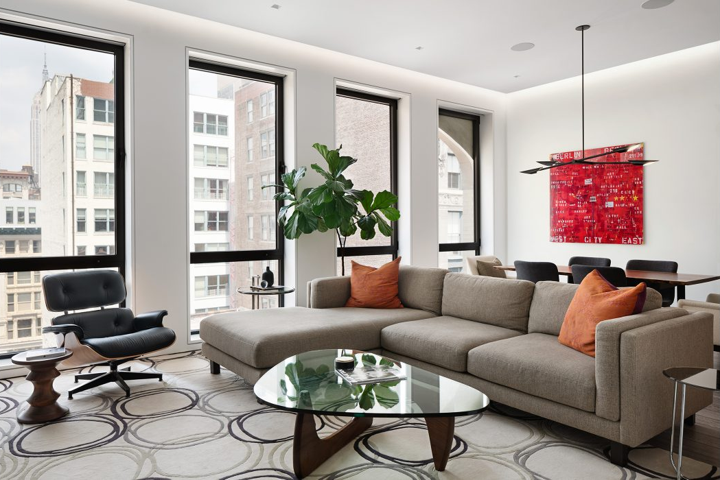 40 West 17th Street, Unit 9A Manhattan, NY 10011 - Photo 1 of 12 a living room with furniture ceiling fan and a window