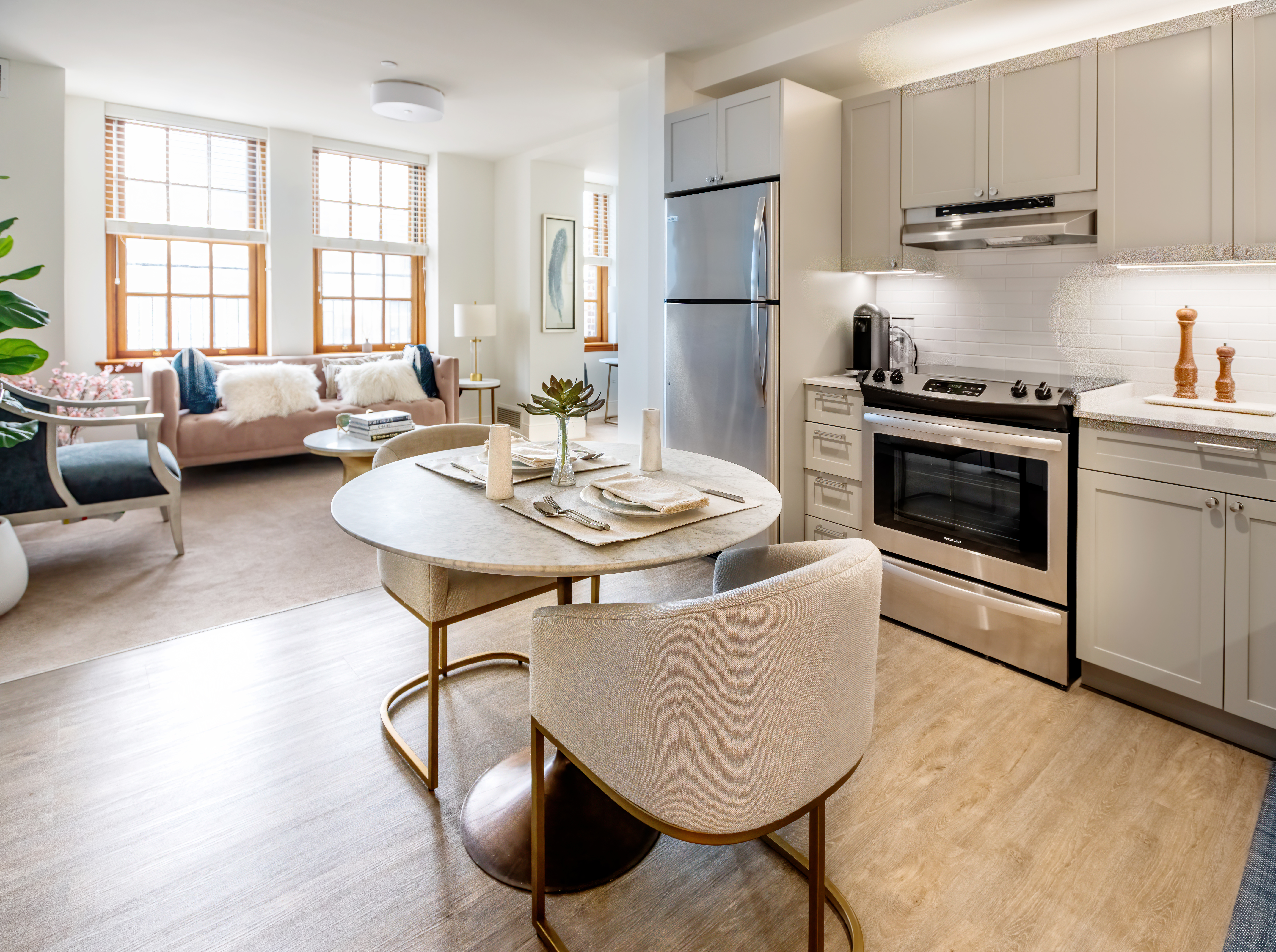 21 Clark Street, Unit RESIDENCE 1305 Brooklyn, NY 11201 - Photo 2 of 19 a kitchen with a table chairs stove and refrigerator