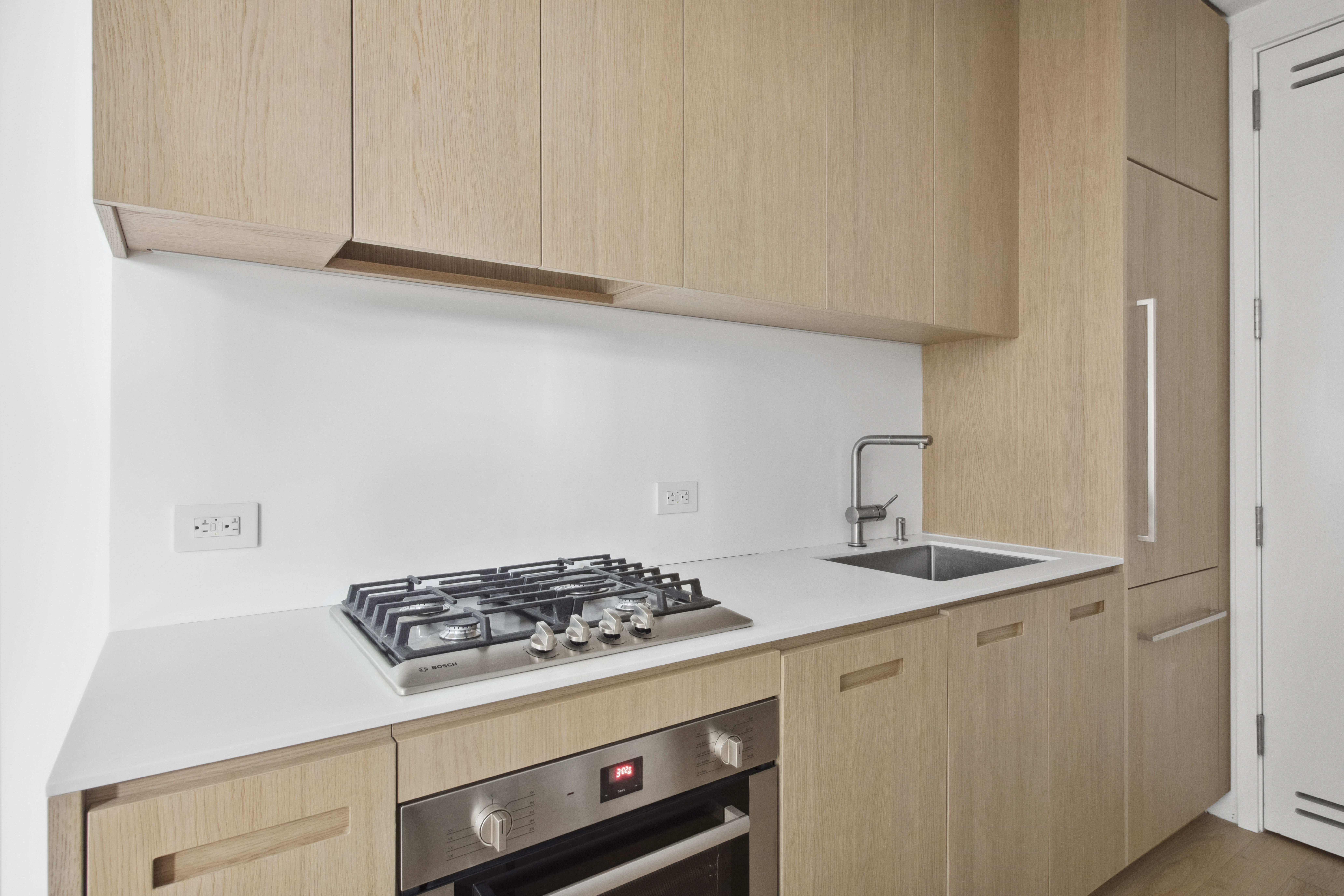 98 Front Street, Unit 9S Brooklyn, NY 11201 - Photo 4 of 12 a stove top oven sitting inside of a kitchen