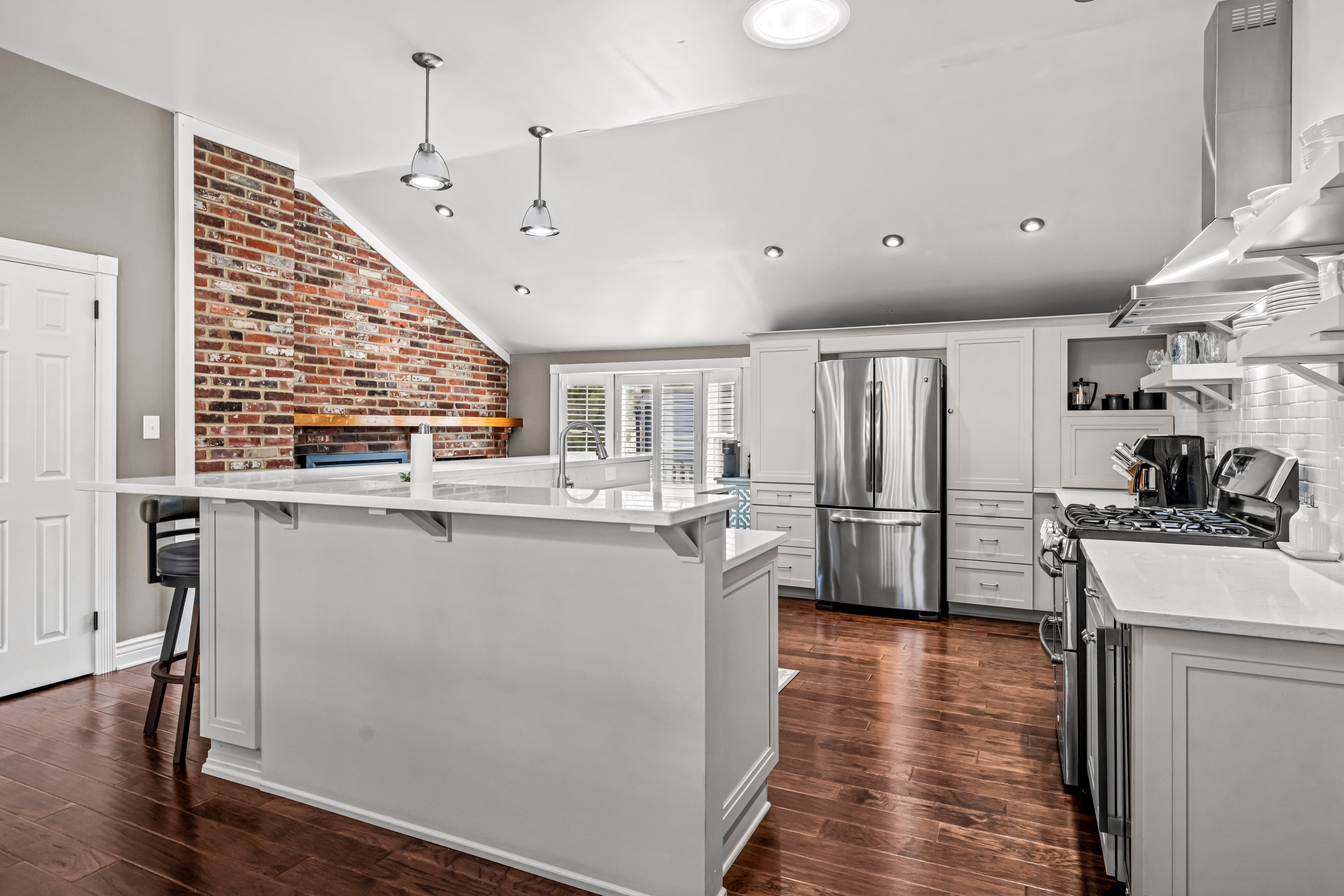 430 Pelham Road Cherry Hill, NJ 08034 - Photo 13 of 48 a kitchen with stainless steel appliances granite countertop a refrigerator a sink dishwasher a stove and white countertops with wooden floor