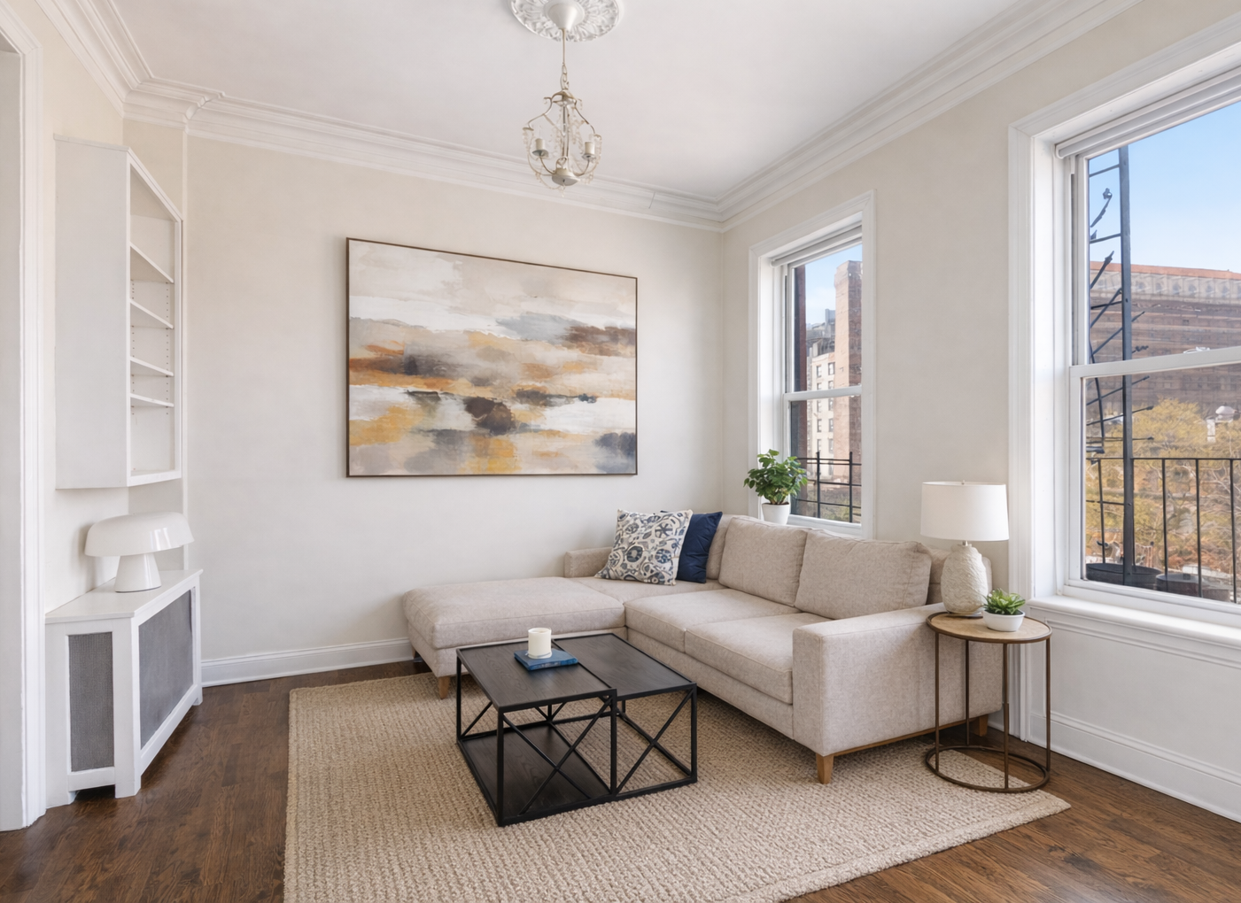 a living room with furniture a wooden floor and a window