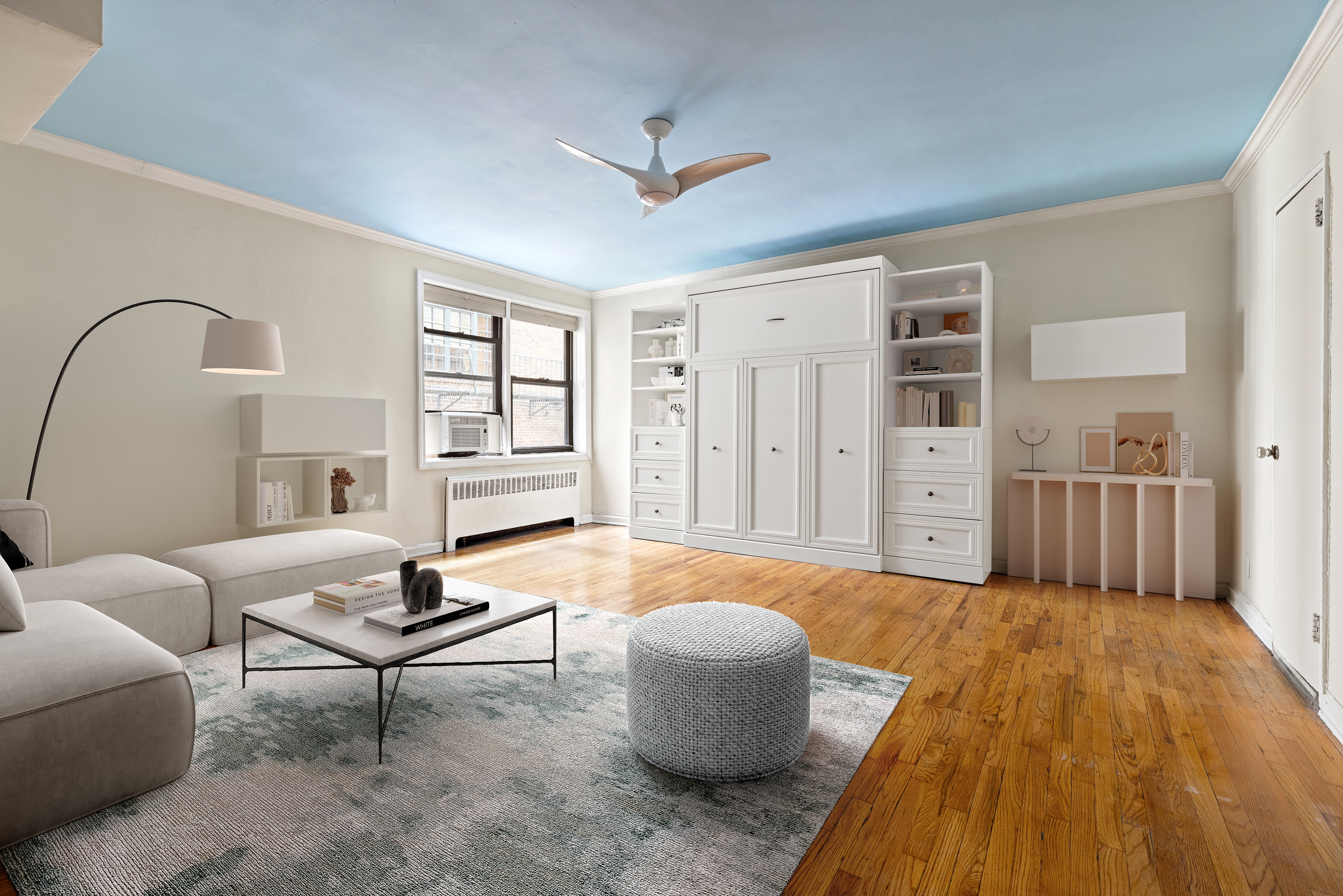 a living room with furniture and wooden floor