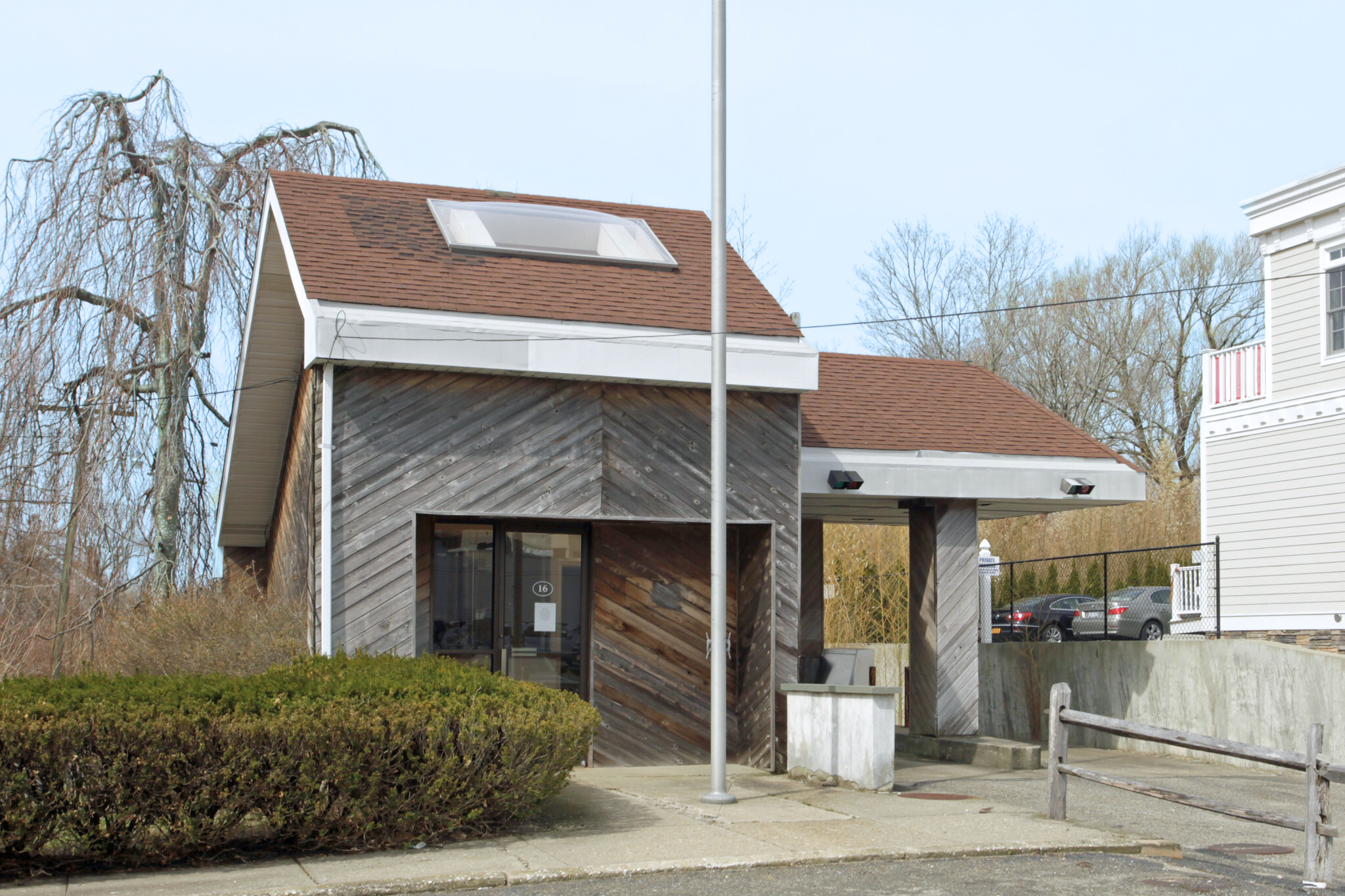 16 Spring Street Sag Harbor, NY 11963 - Photo 2 of 12 a front view of a house with garden