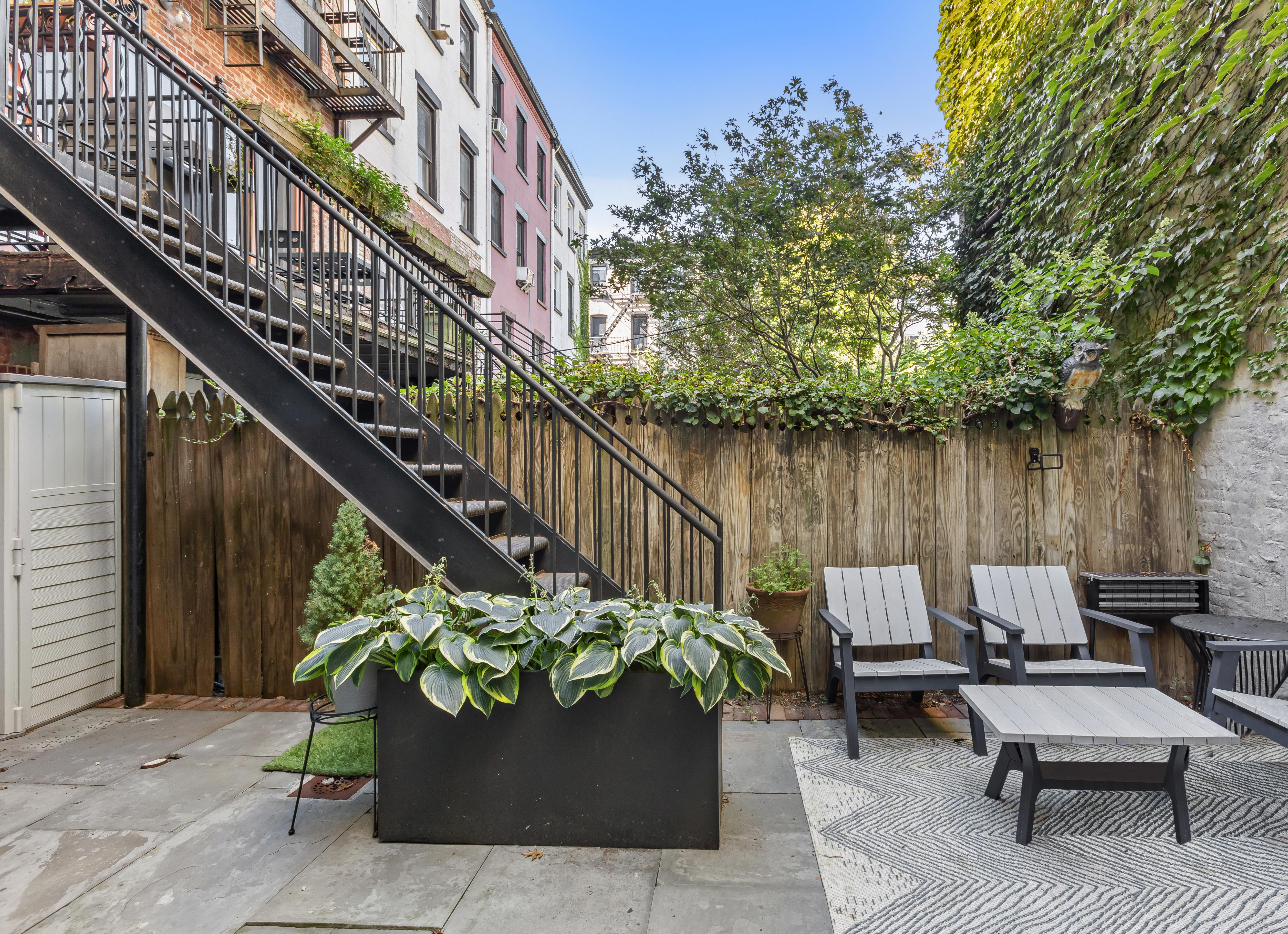 227 Garfield Place, Unit Garden Duplex Brooklyn, NY 11215 - Photo 4 of 15 a view of a chair and tables in the balcony